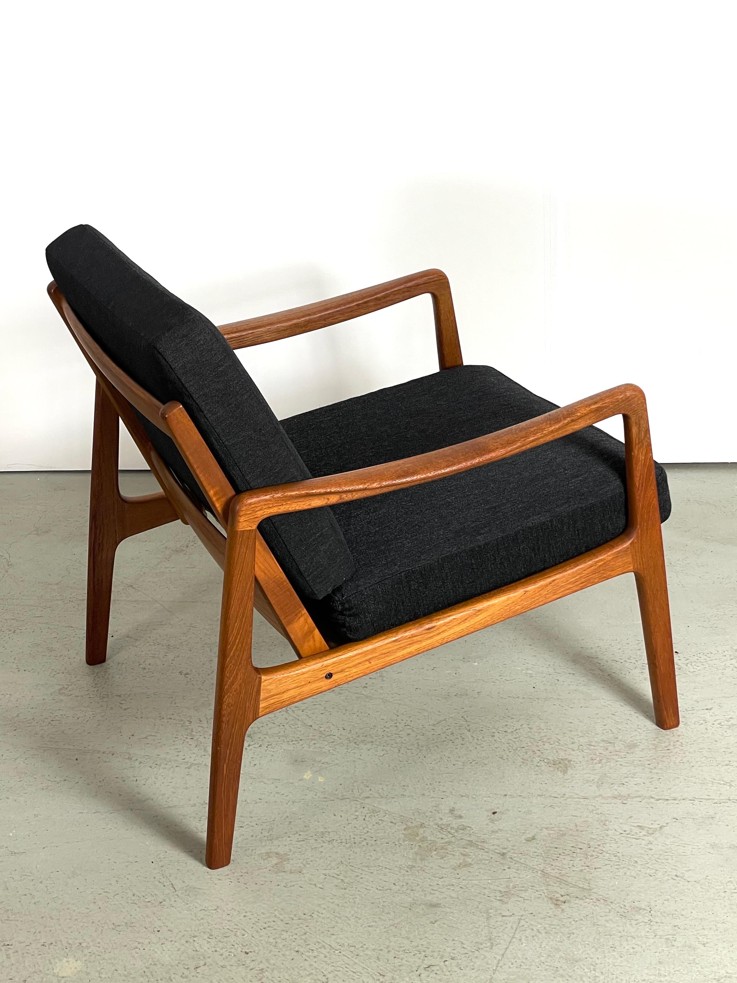Midcentury easy chair designed by Danish Professor Ole Wanscher. Made in Denmark by France & Søn during the 1950s. This rare vintage model FD-109 lounge chair maintains the manufacturer’s mark and features a sturdy teak wooden frame with a slated