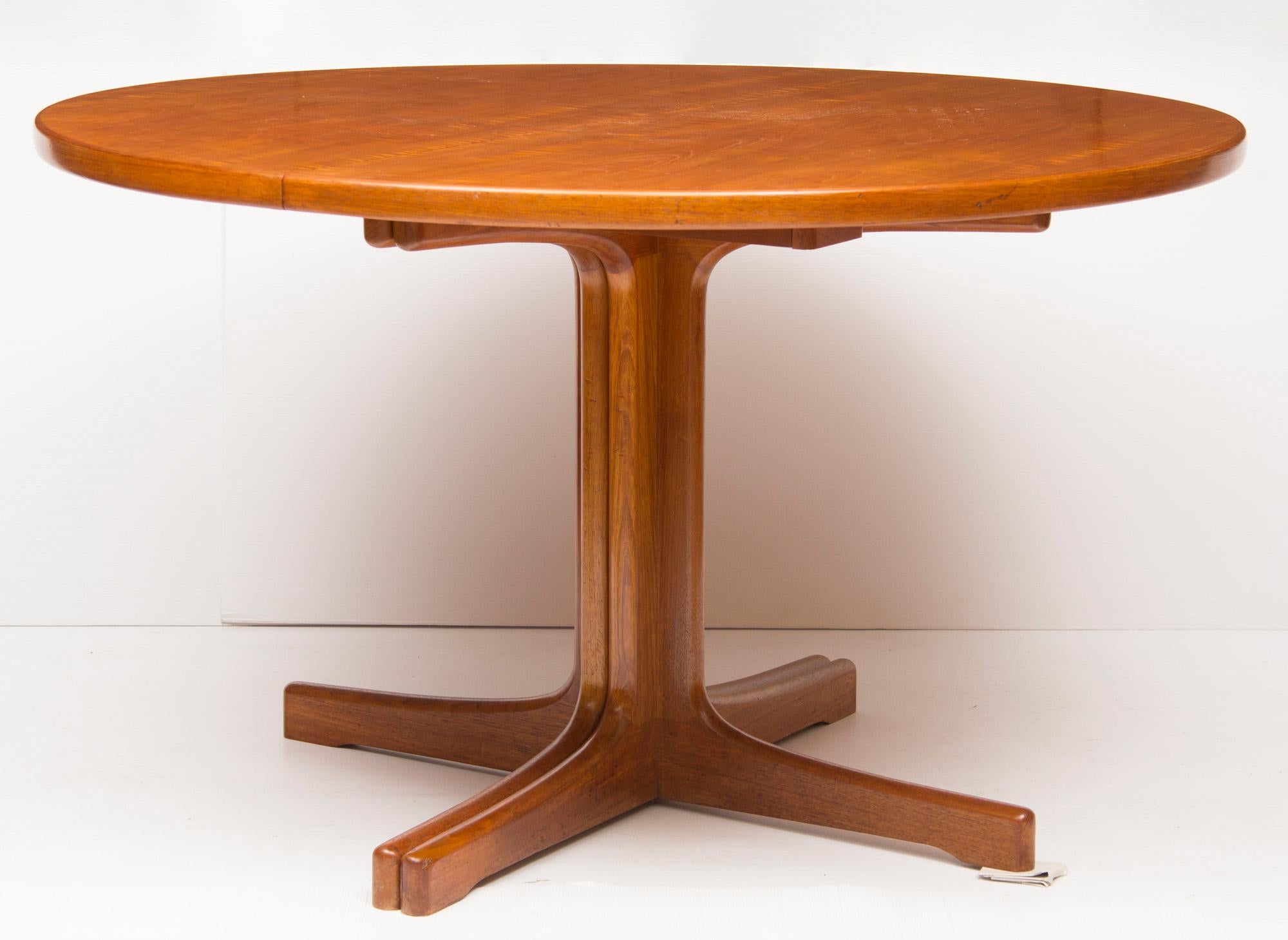 Danish teak extending dining table. Extending to 242cm by 121cm..