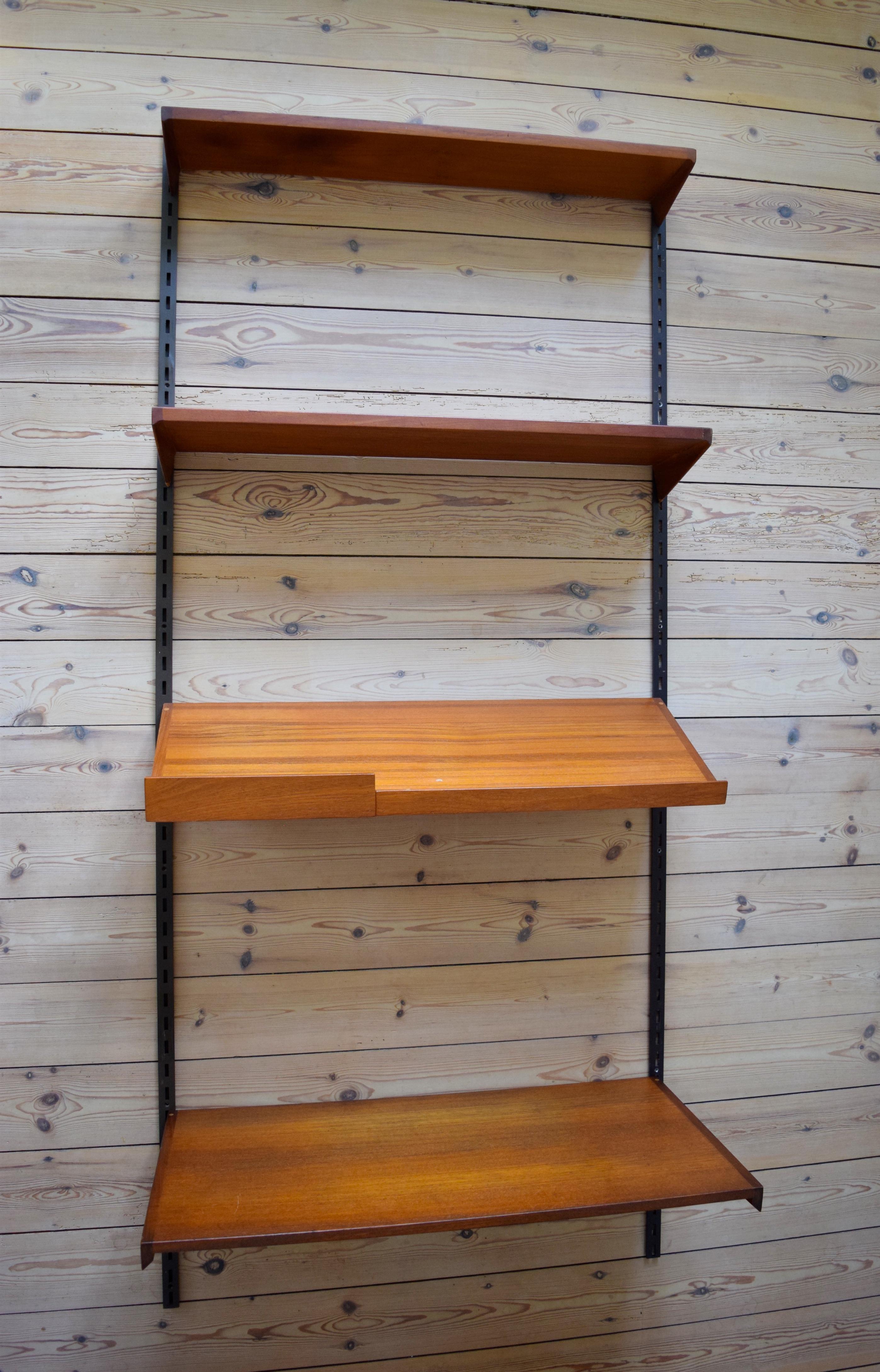 Set of four teak shelves by Kai Kristiansen and manufactured by FM Møbler, Denmark from the 1960s. This system comprises of two 24cm height adjustable shelves, magazine shelf, desk shelf and two hanging rails. Labelled by manufacturer.