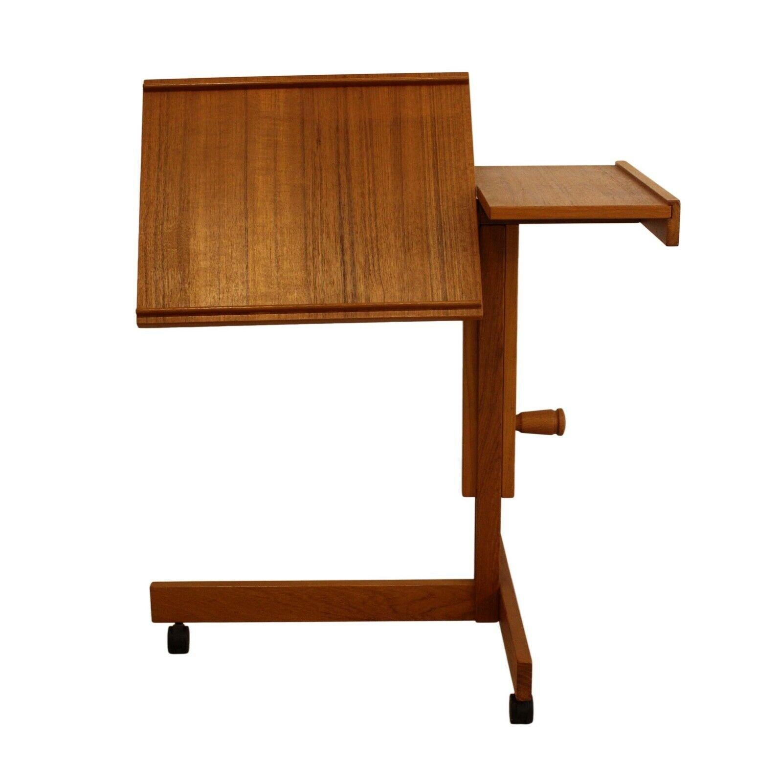 Timeless and functional, this solid teak stand can be used for a chairside laptop table, writing Stand, or tray as the adjustable top pivots for angled viewing or horizontal tray service. In very good condition with little or no wear.

Dimensions: