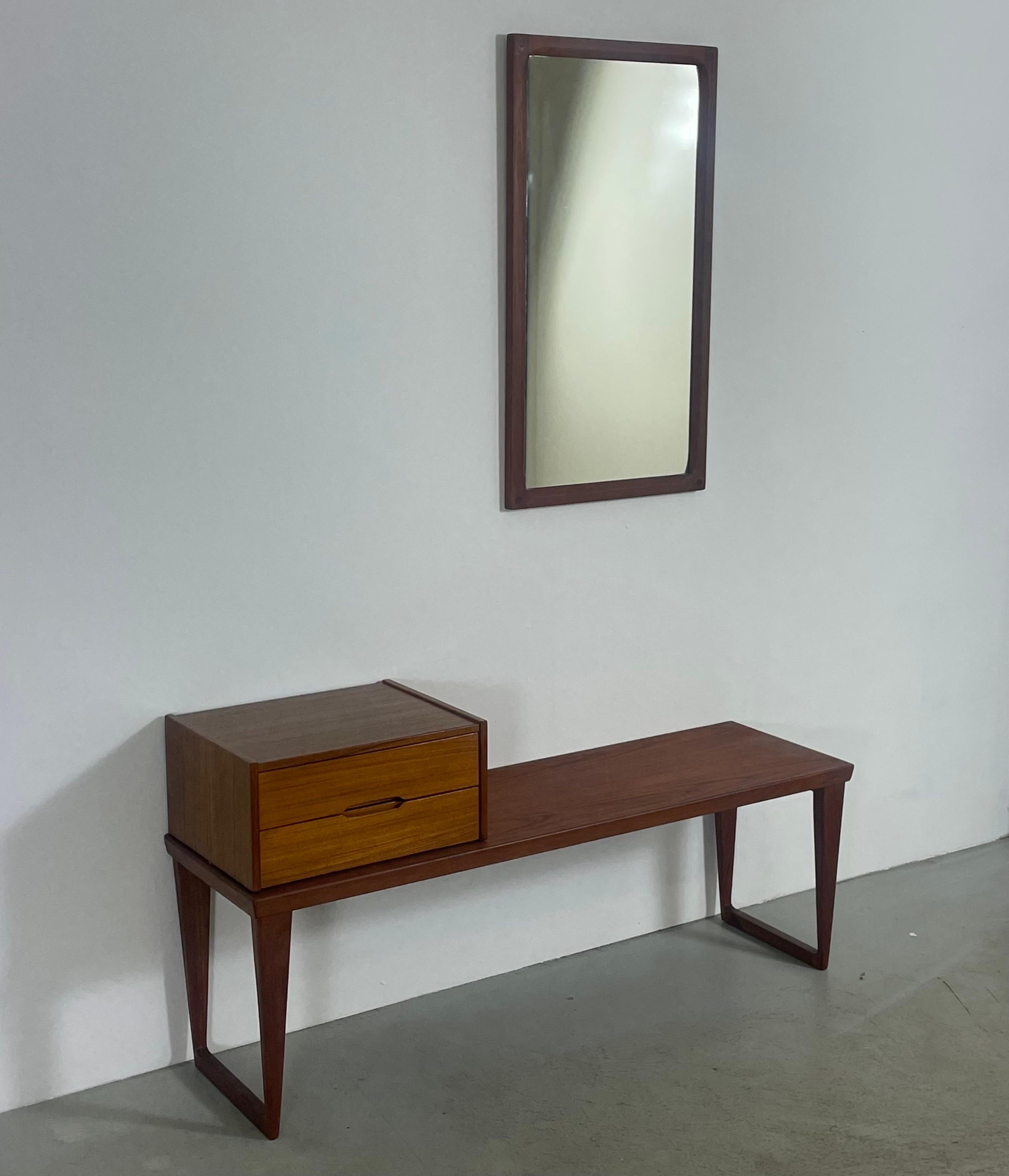 This Scandinavian hallway set was designed by Danish architect Kai Kristiansen for Aksel Kjersgaard. Made in Denmark during the 1960s. The set consists of a freestanding beside table, with a free standing drawer module/chest on top and a matching