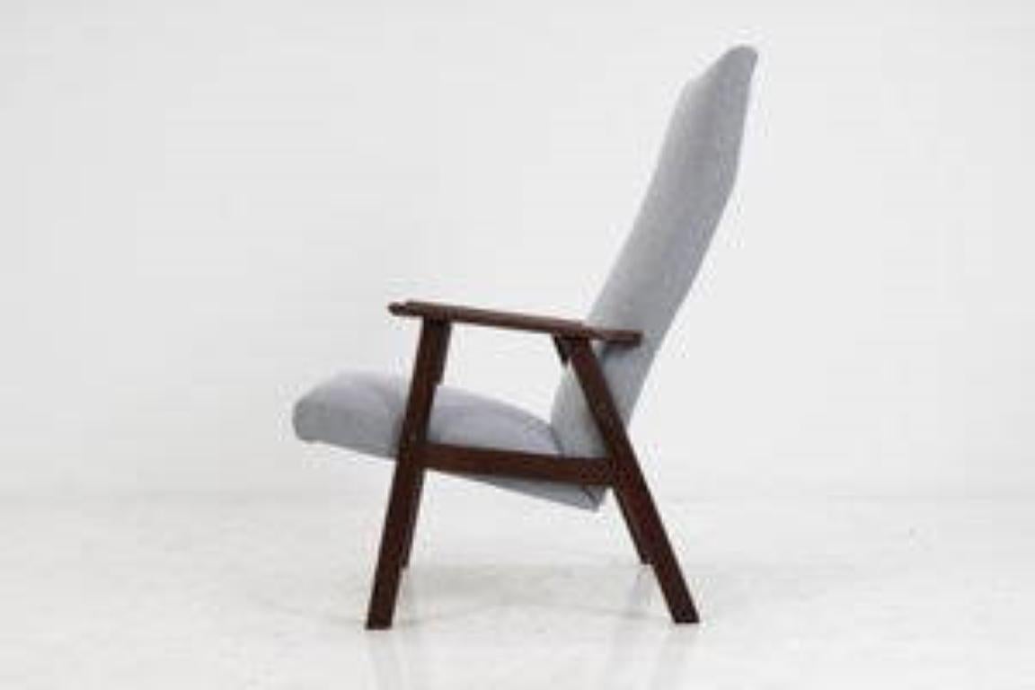 - The chair features wooden teak frame and new fabric upholstery
- Very good condition.