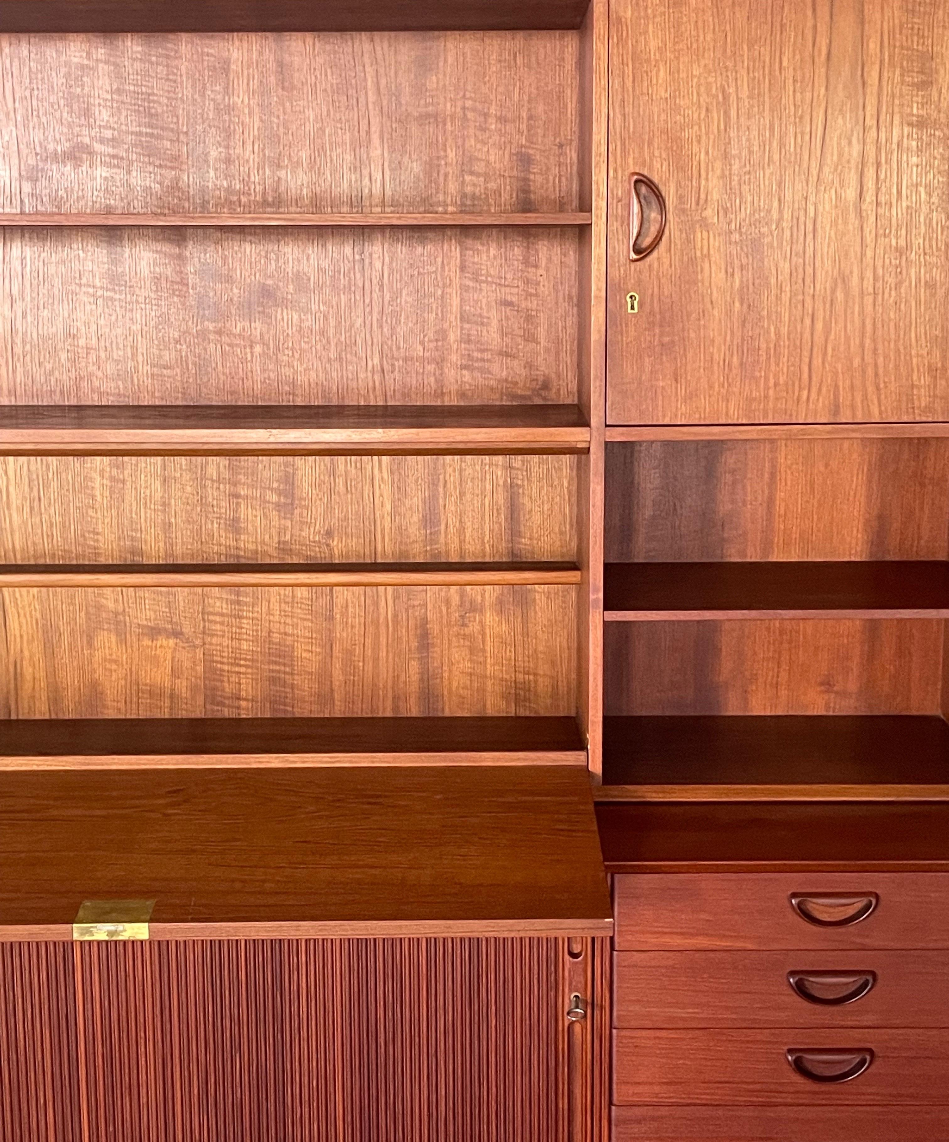 A modular set by Peter Hvidt & Orla Mølgaard Nielsen. Made of solid teak wood by Søborg Møbelfabrik in Denmark, 1950s. The set includes the iconic sideboard Model 309C, with an additional shelve – which can be placed on top on demand. Both are in