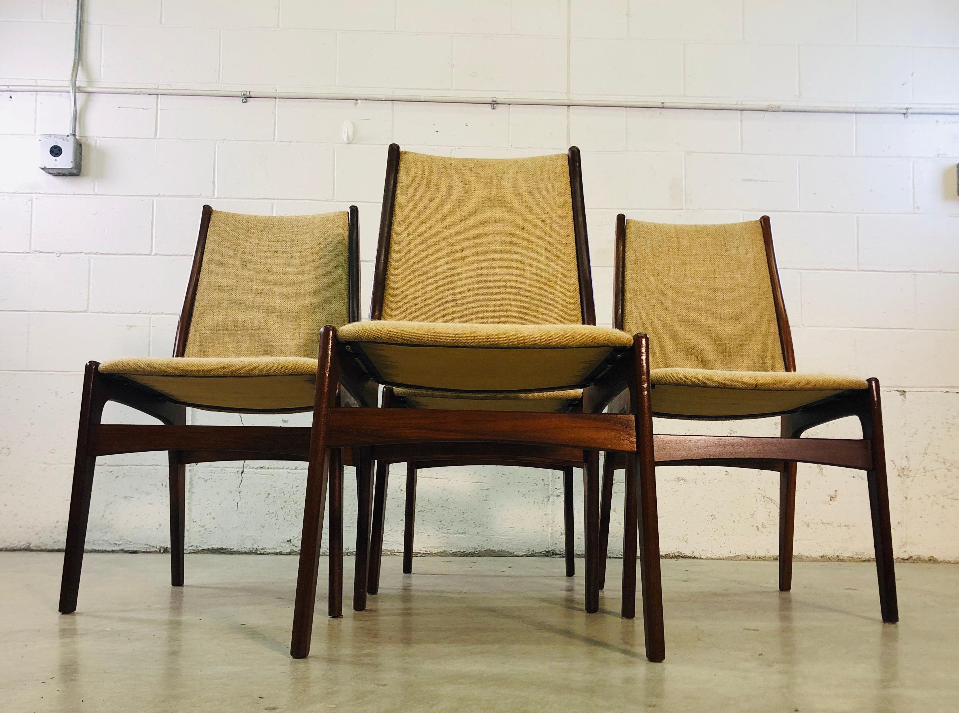 Vintage Danish teak dining room chairs designed by Johannes Andersen for Uldum Mobelfabrik. The chairs have the original tweed cloth upholstry. This is a set of 4, the chairs have all be restored and are sturdy. No marks. Very good condition.