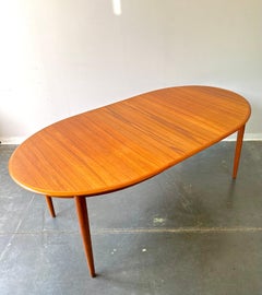 Danish teak mcm oval dining table with leaves