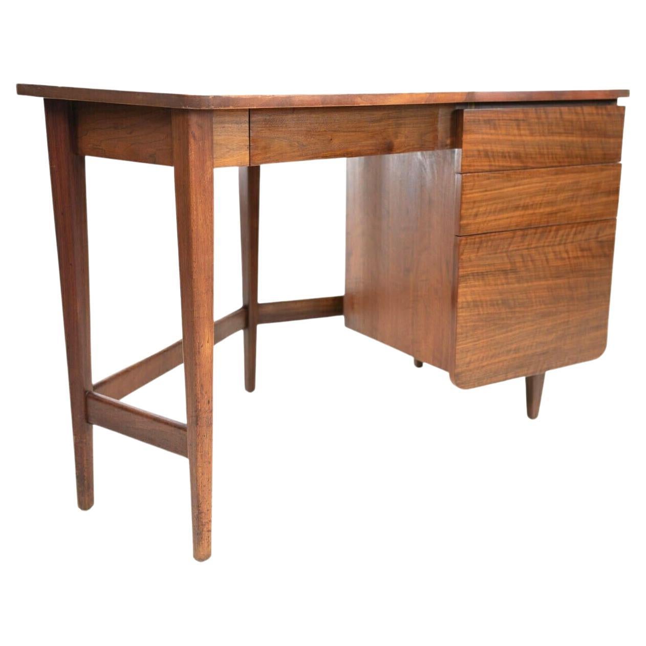 Danish teak mid century corner desk

A teak mid-century boomerang style six-sided corner desk. 

Clean minimal mid-century lines. Featuring a hidden drawer under the desktop and a further three drawers to the righthand side. The lower drawer is