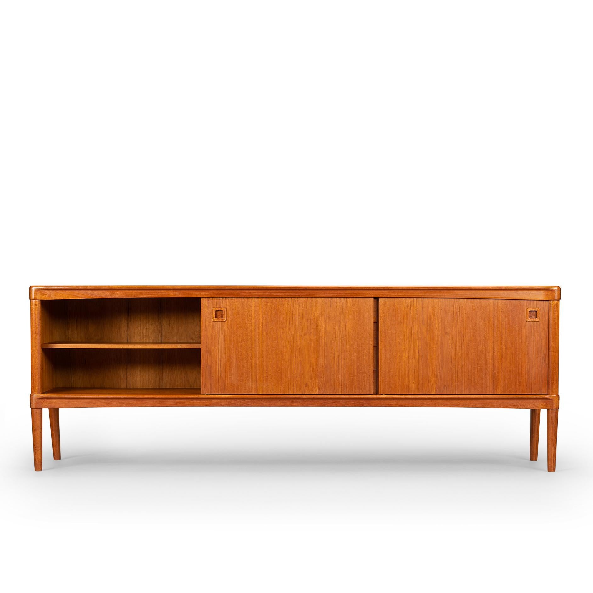 This credenza by H.W. Klein has some very nice design features. The back legs are positioned inward and bring a twist to this credenza design! Klein was inspired by natural shapes and curvature and worked this inspiration into furniture designs with