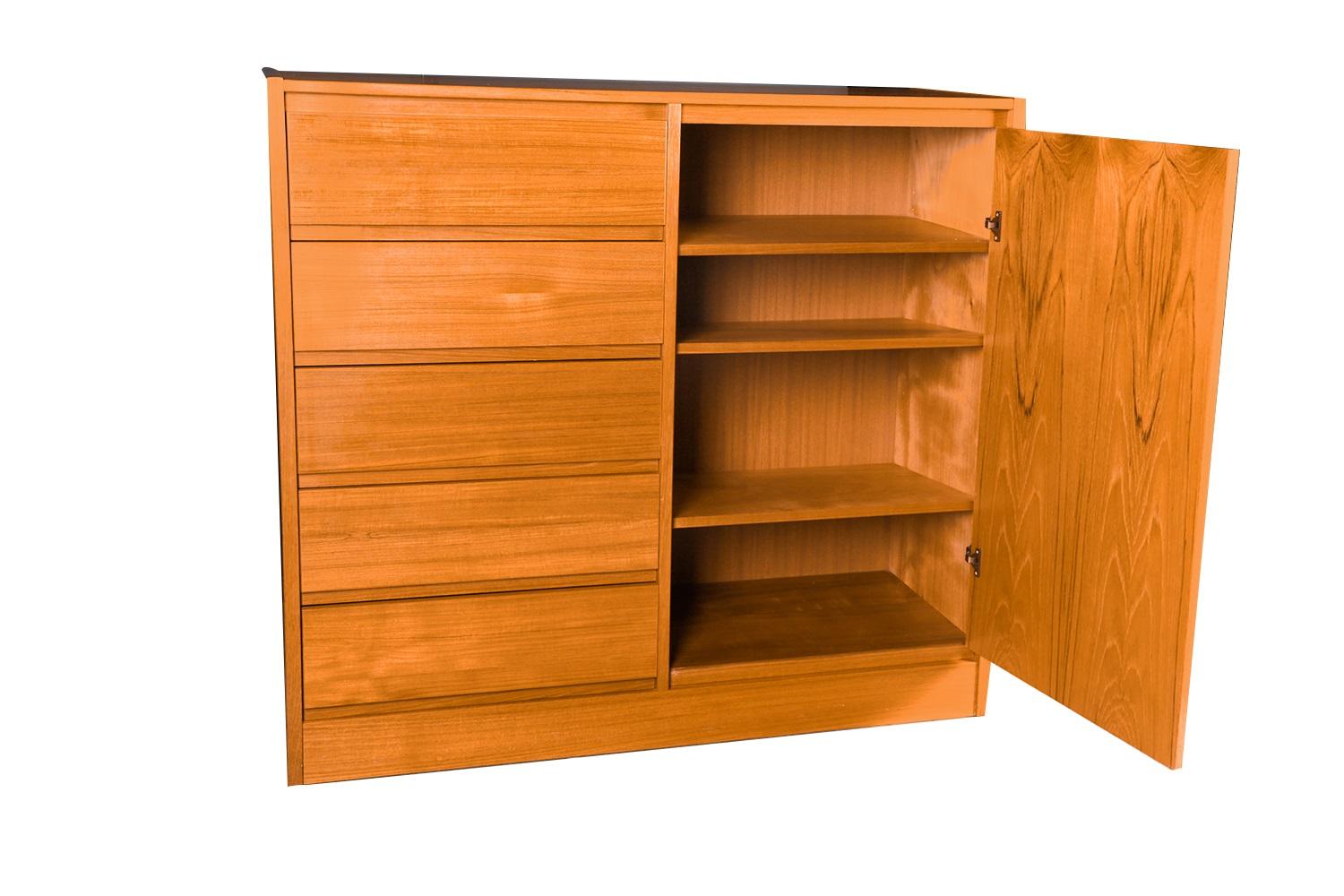 Beautiful Mid-Century Modern highboy, gentleman’s tall dresser, wardrobe, circa 1970's. Don’t be fooled by the term “Gentleman’s Chest” – this high functioning storage piece is really gender neutral, with plenty of storage making it well-suited as a
