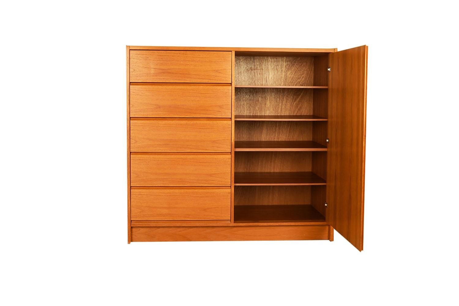 Beautiful mid-century modern highboy, gentleman’s tall dresser, wardrobe, circa 1970’s. Don’t be fooled by the term “Gentleman’s Chest” – this high functioning storage piece is really gender neutral, with plenty of storage making it well-suited as a