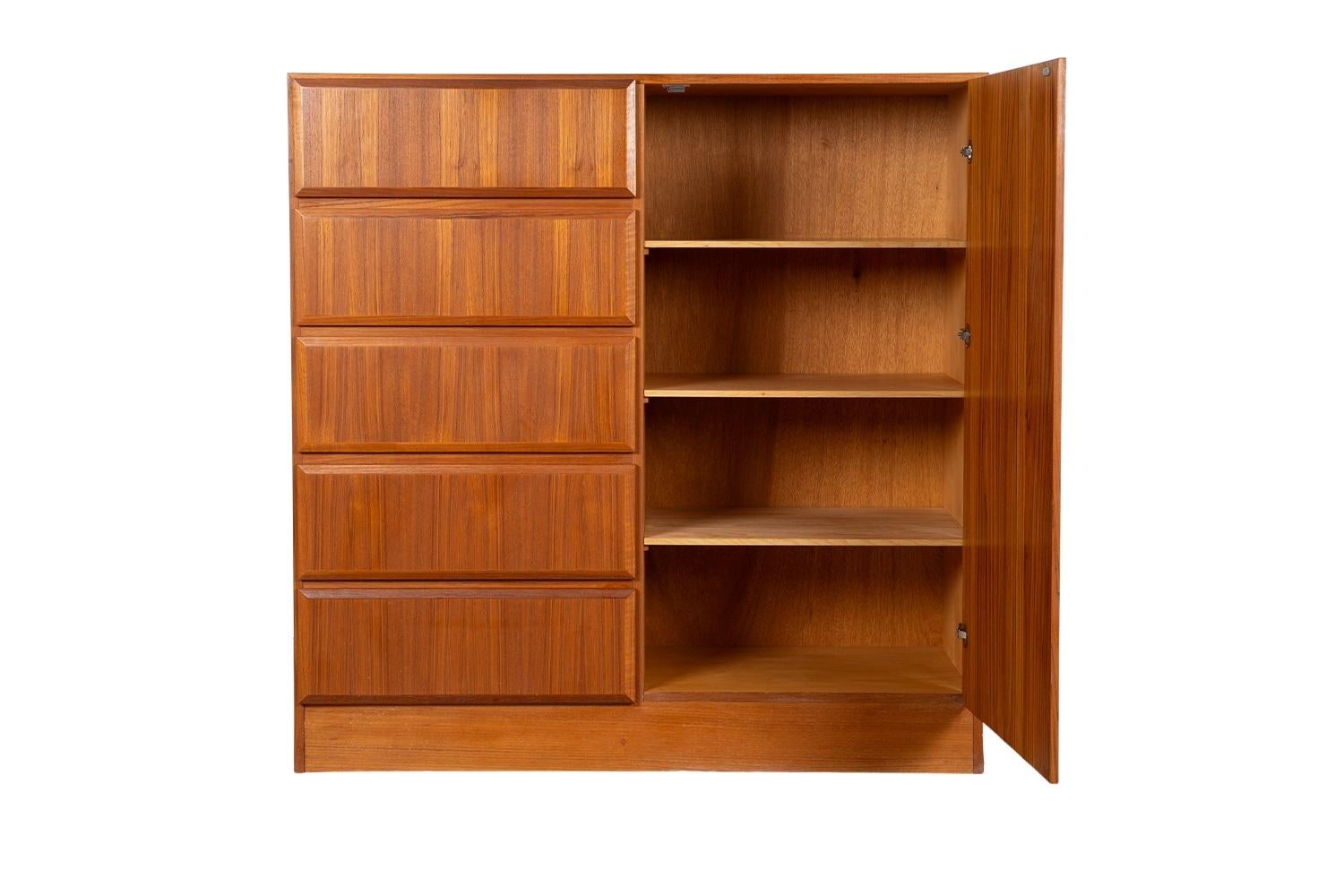 Beautiful mid-century modern highboy, gentleman’s tall dresser, wardrobe, circa 1970’s. Don’t be fooled by the term “Gentleman’s Chest” – this high functioning storage piece is really gender neutral, with plenty of storage making it well-suited as a