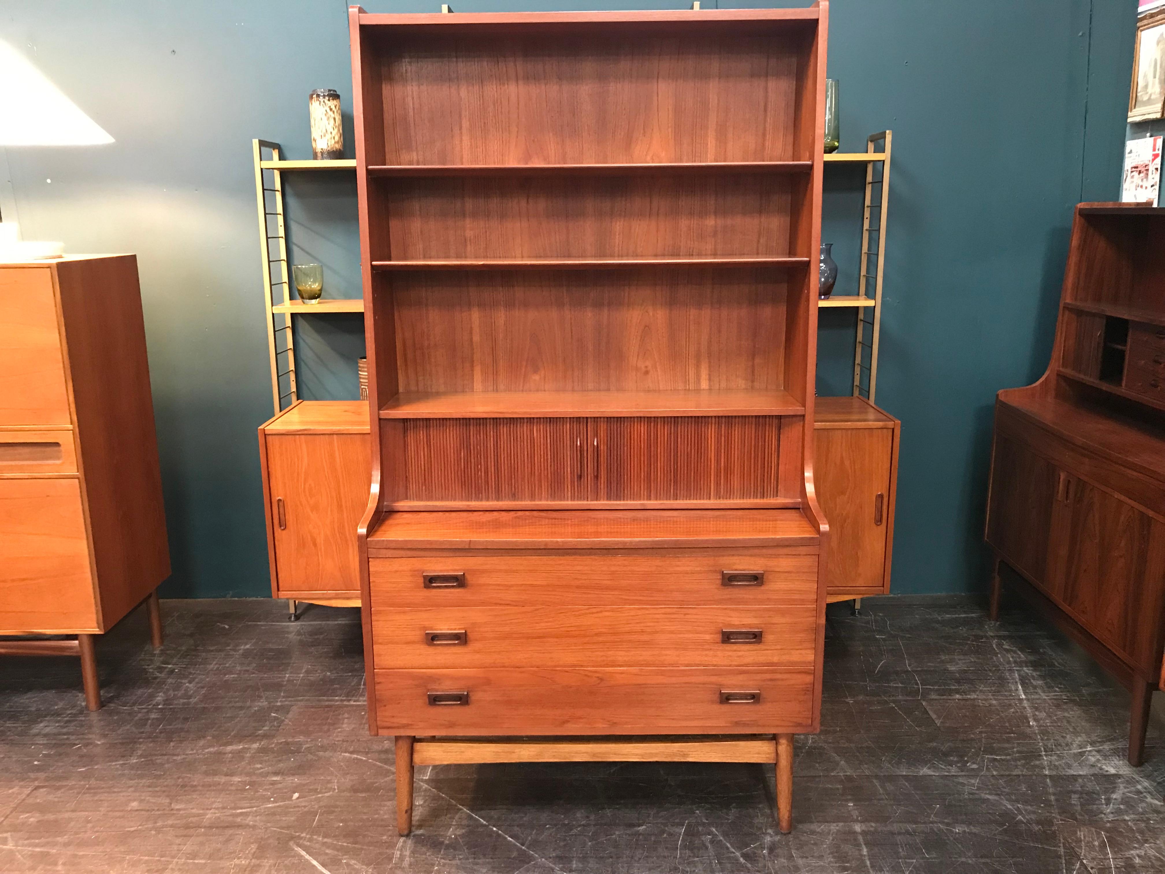 This stunning teak desk is an elegant offering from one of Denmark’s finest furniture makers. This high secretaire was designed in the 1960s by Johannes Sorth. It features three large drawers, a pull-out desktop above the drawers (with a depth of