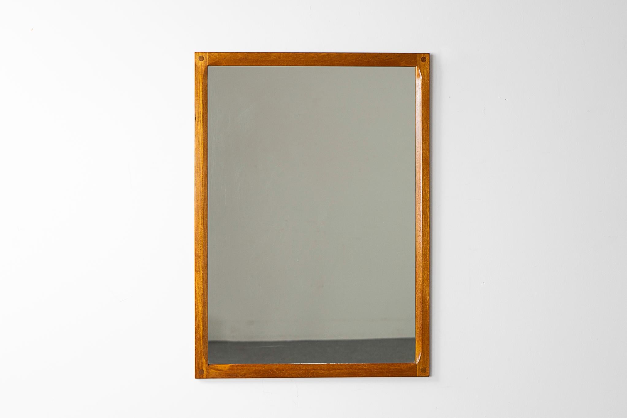 Teak mid-century mirror by Kai Kristiansen, circa 1960's. Solid teak frame with lovely graining, beautiful joinery and beveled inner edges. Quality!

Please inquire for remote and international shipping rates.