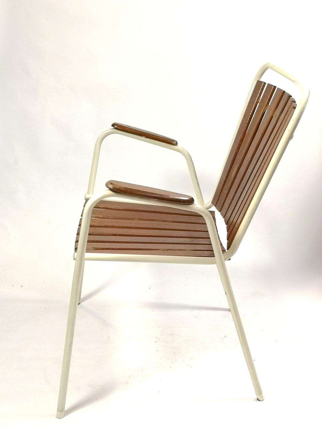 Set of 4 Mid-century modern Danish teak outdoor chairs. Apart from some minor damages attributed to usage, the chairs are in good condition. The back and seat are made of teak wood. Classical, elegant design.
