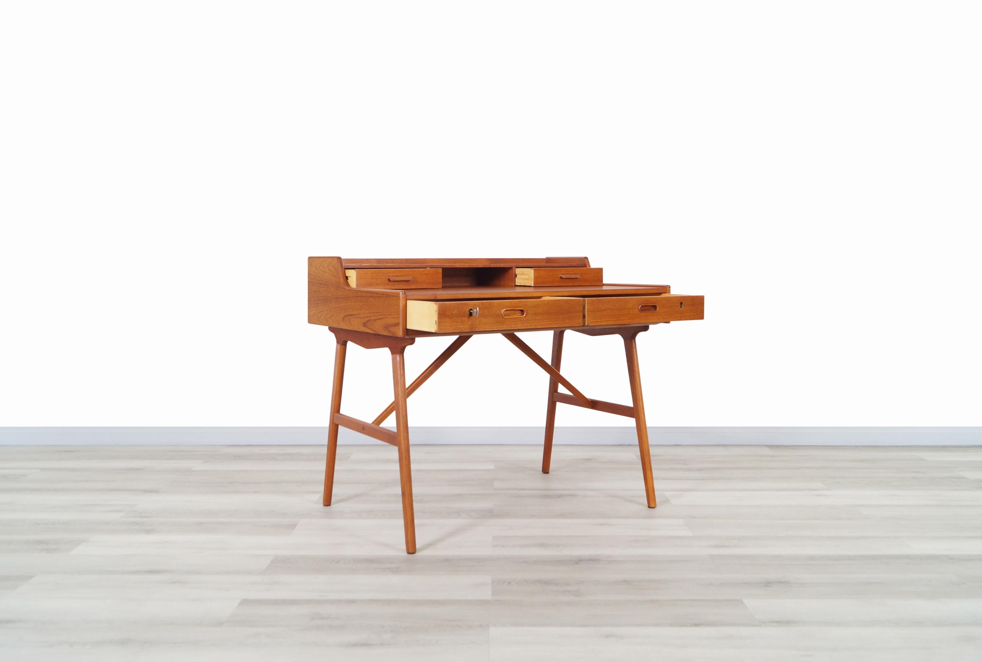 Mid-Century Modern Danish Teak Model #64 Desk by Arne Wahl Iversen