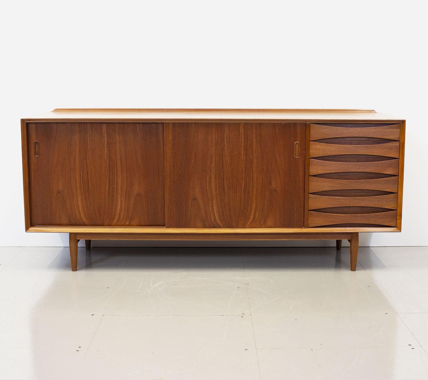 Teak model OS29 sideboard by Arne Vodder for Sibast. Designed in the late 1950s it is now an iconic piece of Danish furniture, known for it’s distinctive and much copied bow tie fronted drawers and reversible doors, it was part of his award winning