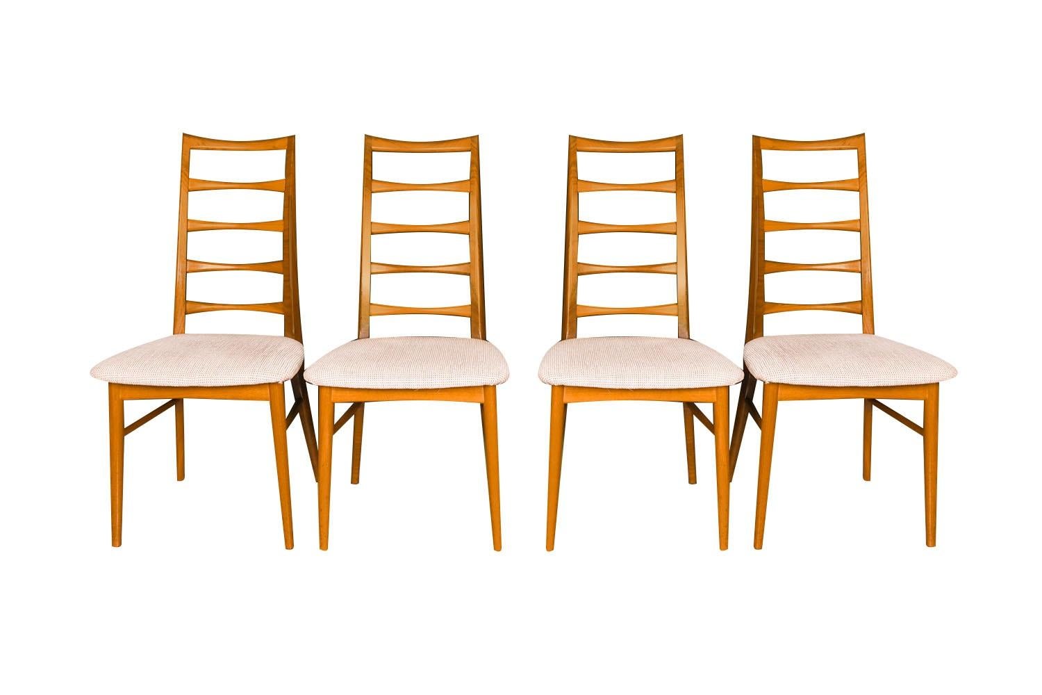 An outstanding set of six teak dining chairs designed by Niels Koefoed for Koefoeds Hornslet, model “Lis” made in Denmark, circa 1960's. This stunning set of six ladder back teak chairs features two arm chairs and four side chairs in original