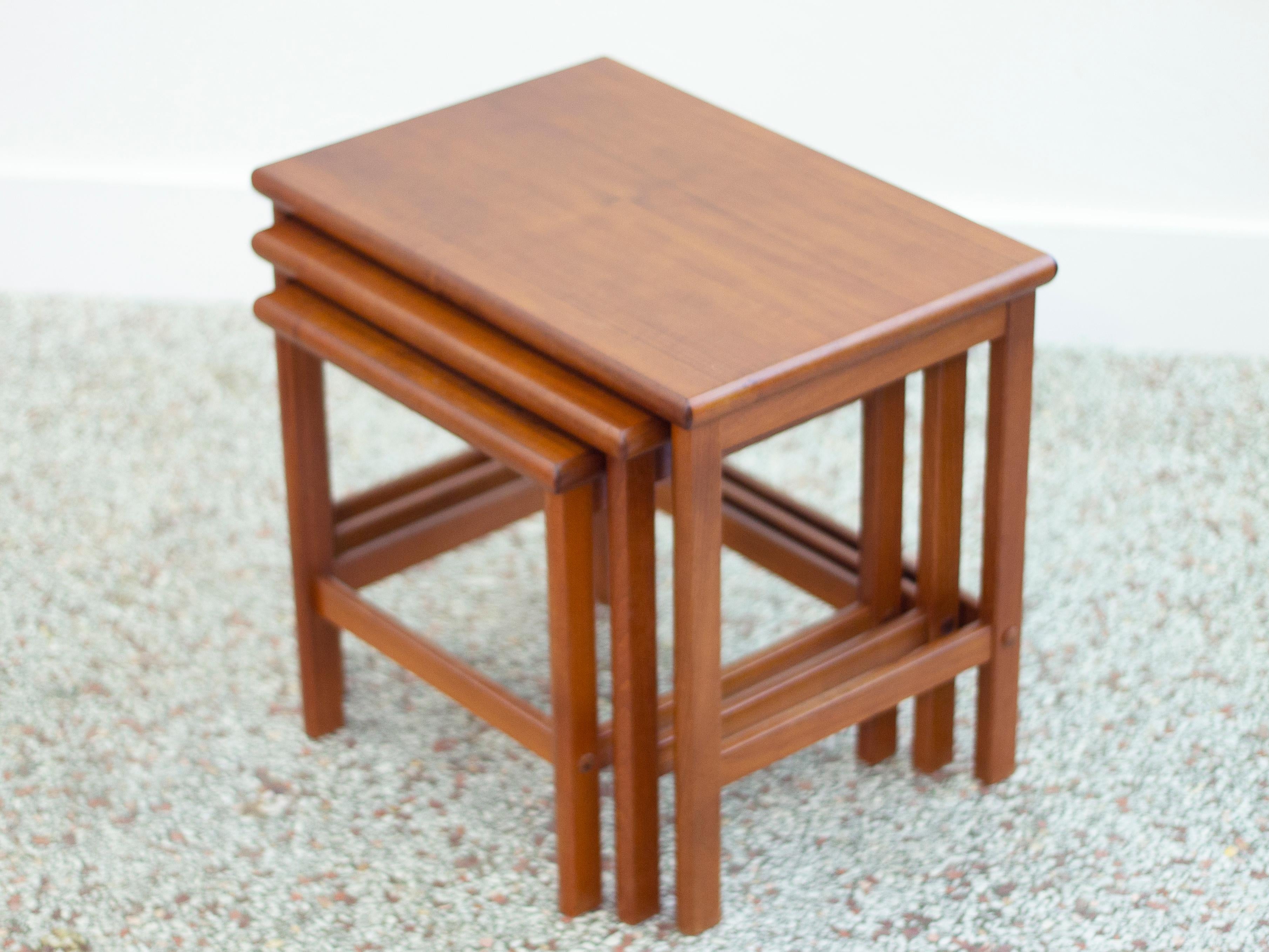 Vintage set of 3 Danish modern nesting tables crafted in teak.
