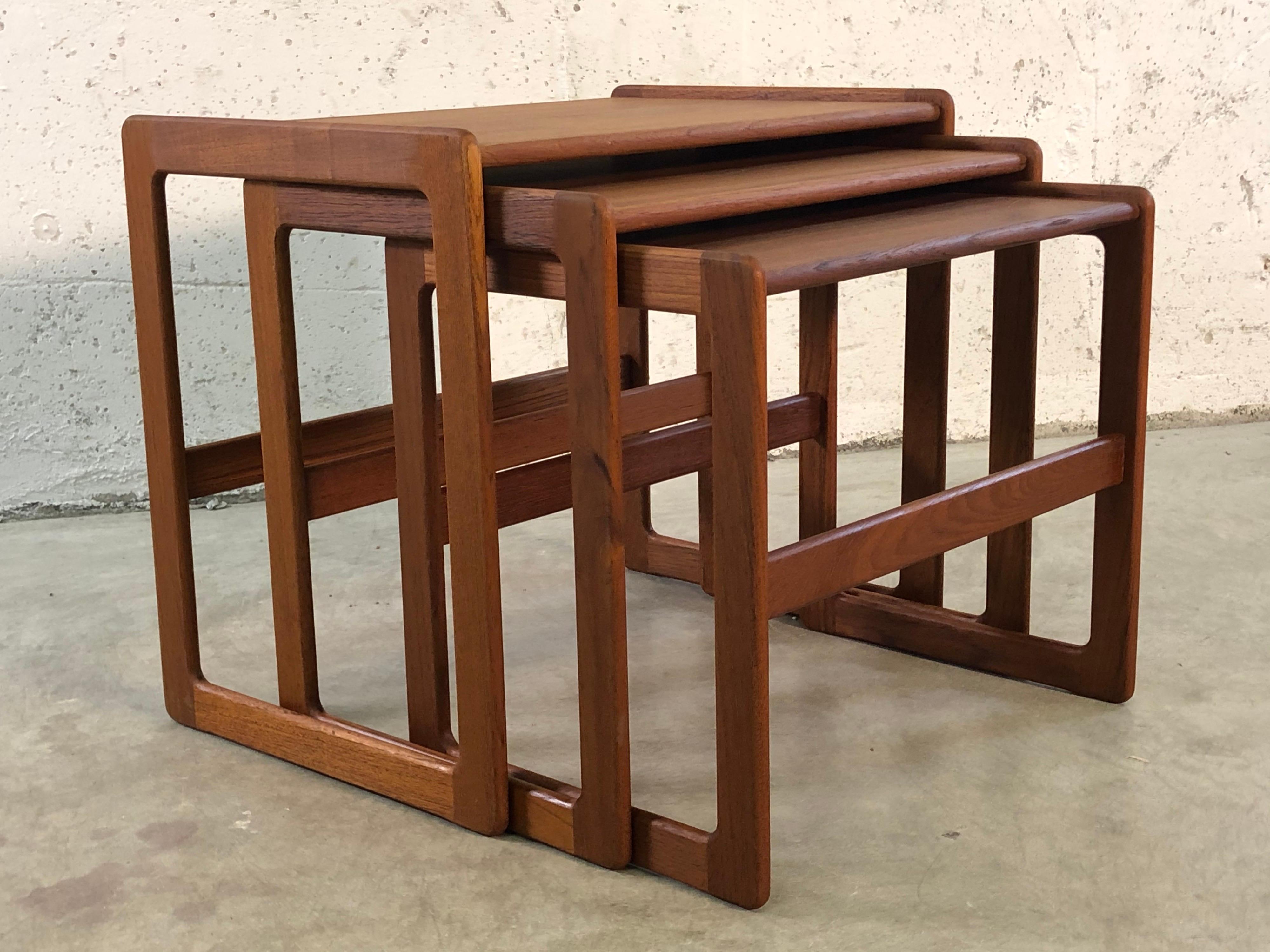 Vintage Danish teak set of 3 nesting tables. The tables have a nice clean line design but are not marked. The tables have all been refinished.