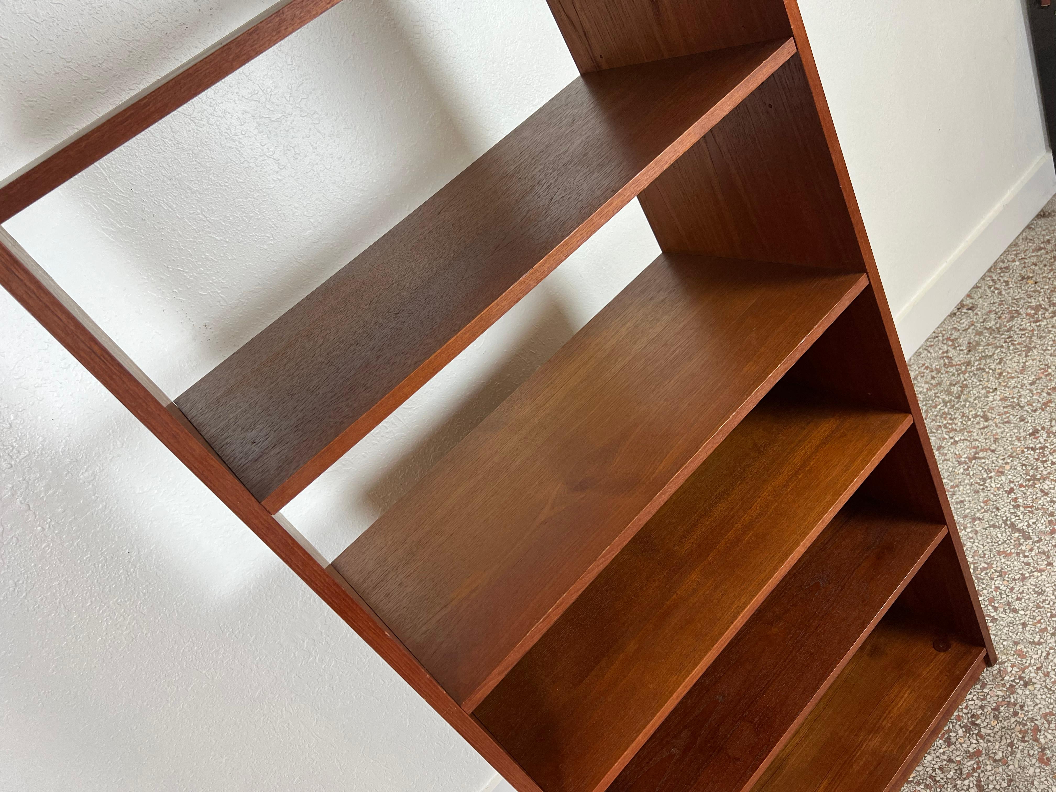 Vintage Danish teak open shelf bookcase with adjustable shelves. Finished on both sides to allow for room floating capabilities. 

Origin: Denmark

Year: 1960s

Style: Mid-Century Modern / Scandinavian / Danish Modern

Dimensions: 30