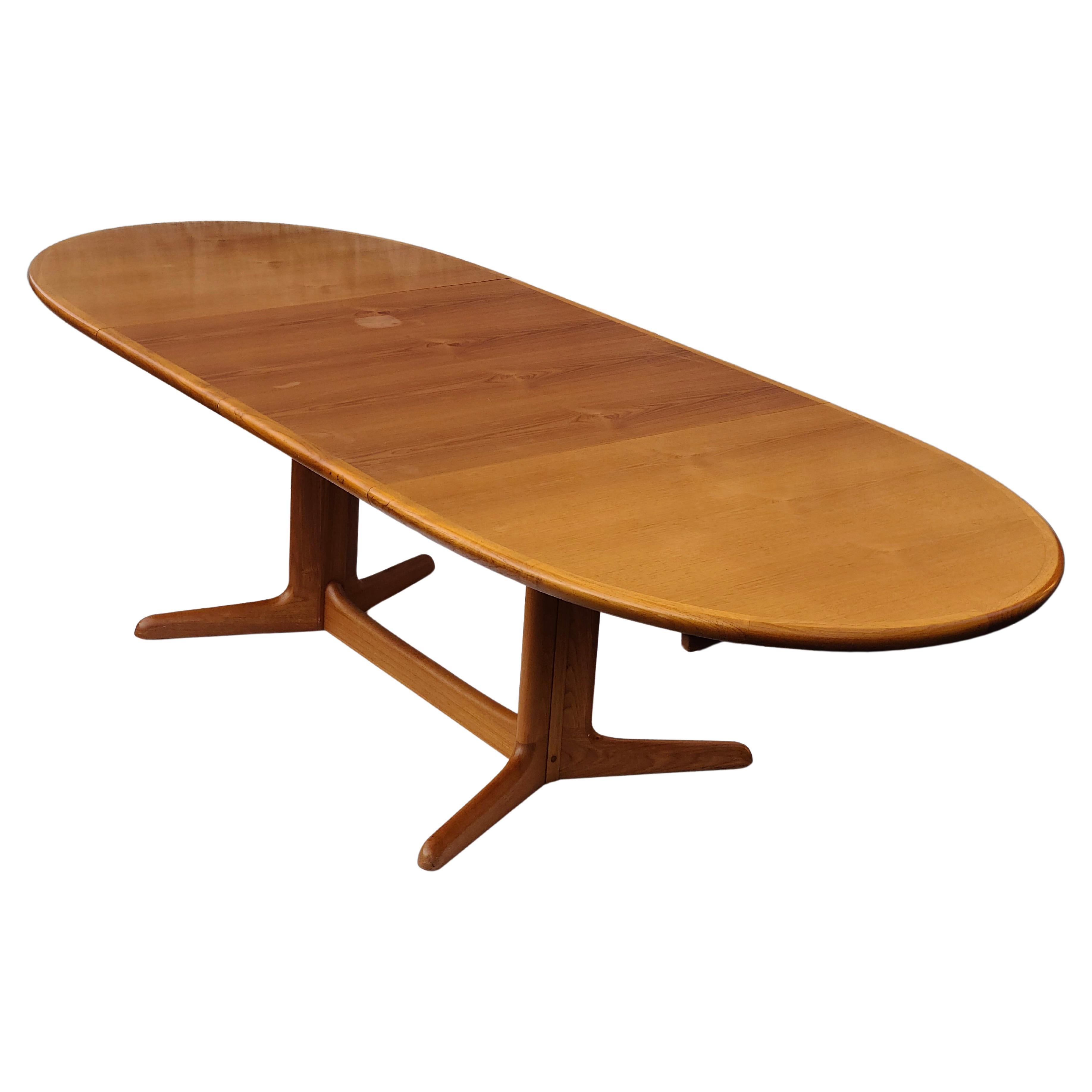 Danish Teak Oval Dining Table. 
64