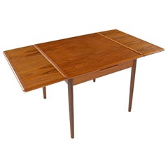 Danish Teak Petit Draw Leaf Expanding Dining Table, circa 1960s