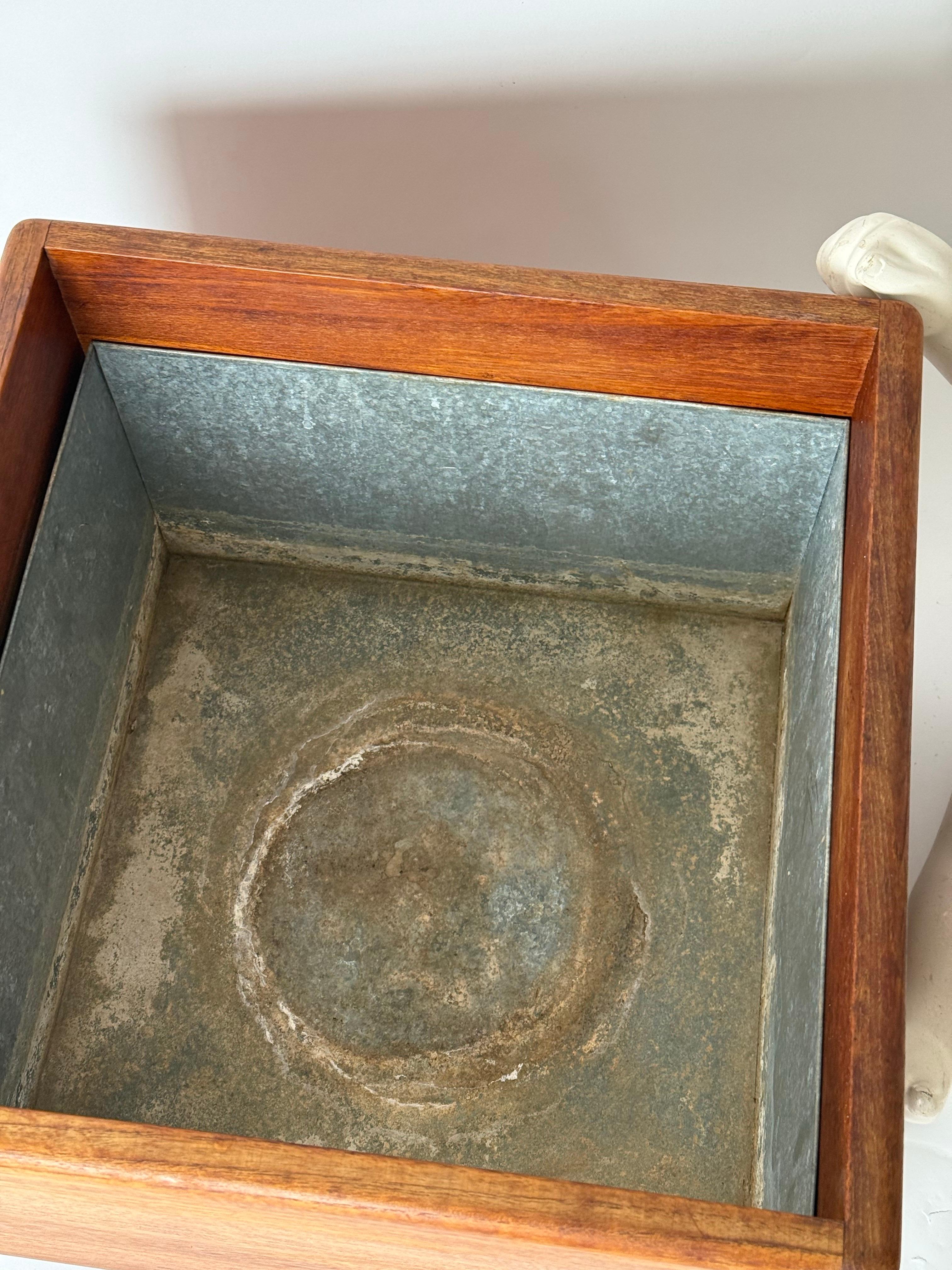 A beautiful planter from the 1970s with casters. Scandinavian simplicity combined with high-quality wood work characterizes this very rare planter from Denmark. Beautiful teak was used here and assembled to a quality that is almost unattainable