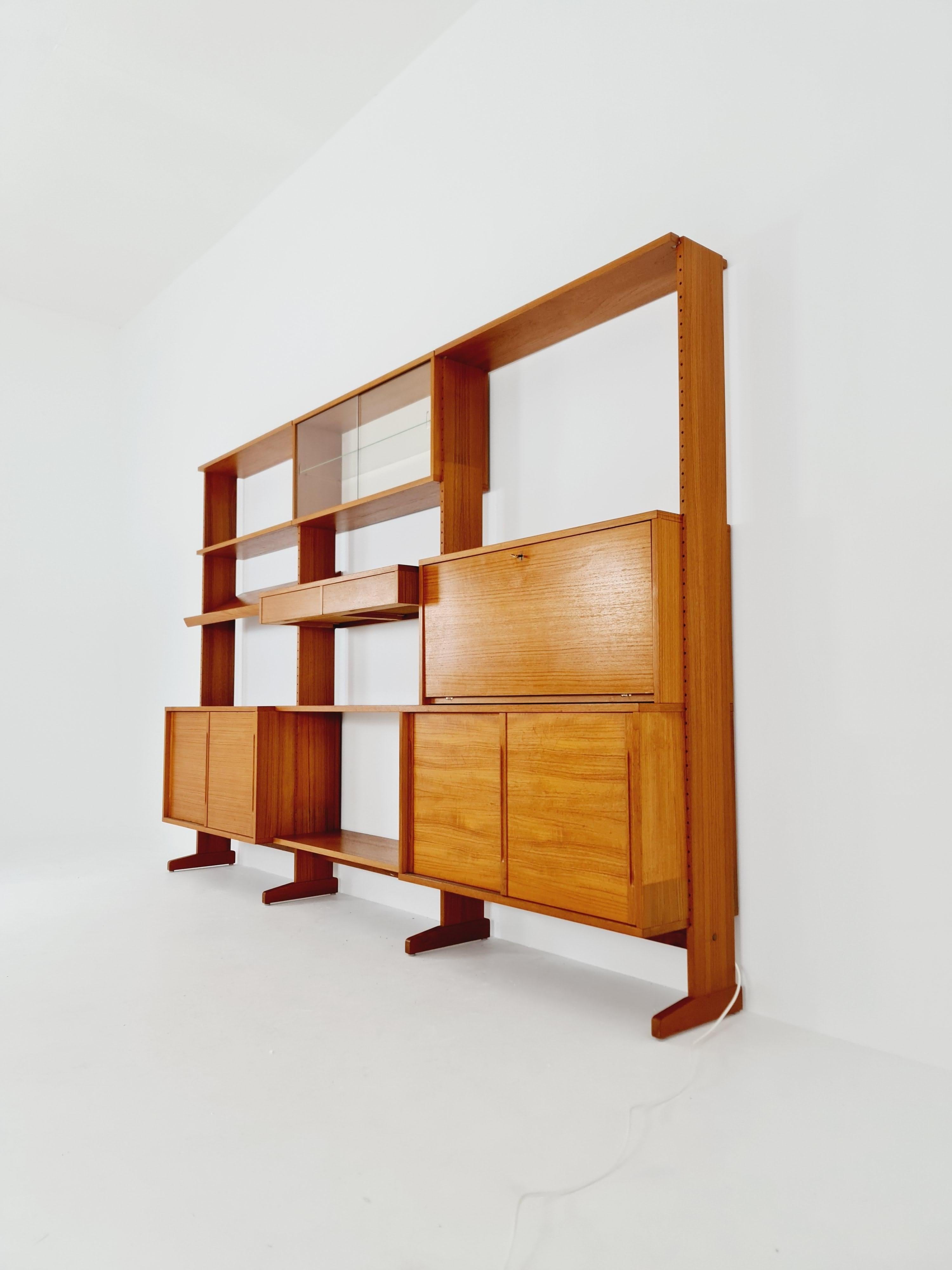 Danish teak room divider vintage library bookcase 

Modular shelf-system by L Chr Larsen & Søn, 1960s

Bookcase - Mobile Bar composed of three modules joined together. Original vintage 60s.

Composed of in the upper part of shelving and a flap that