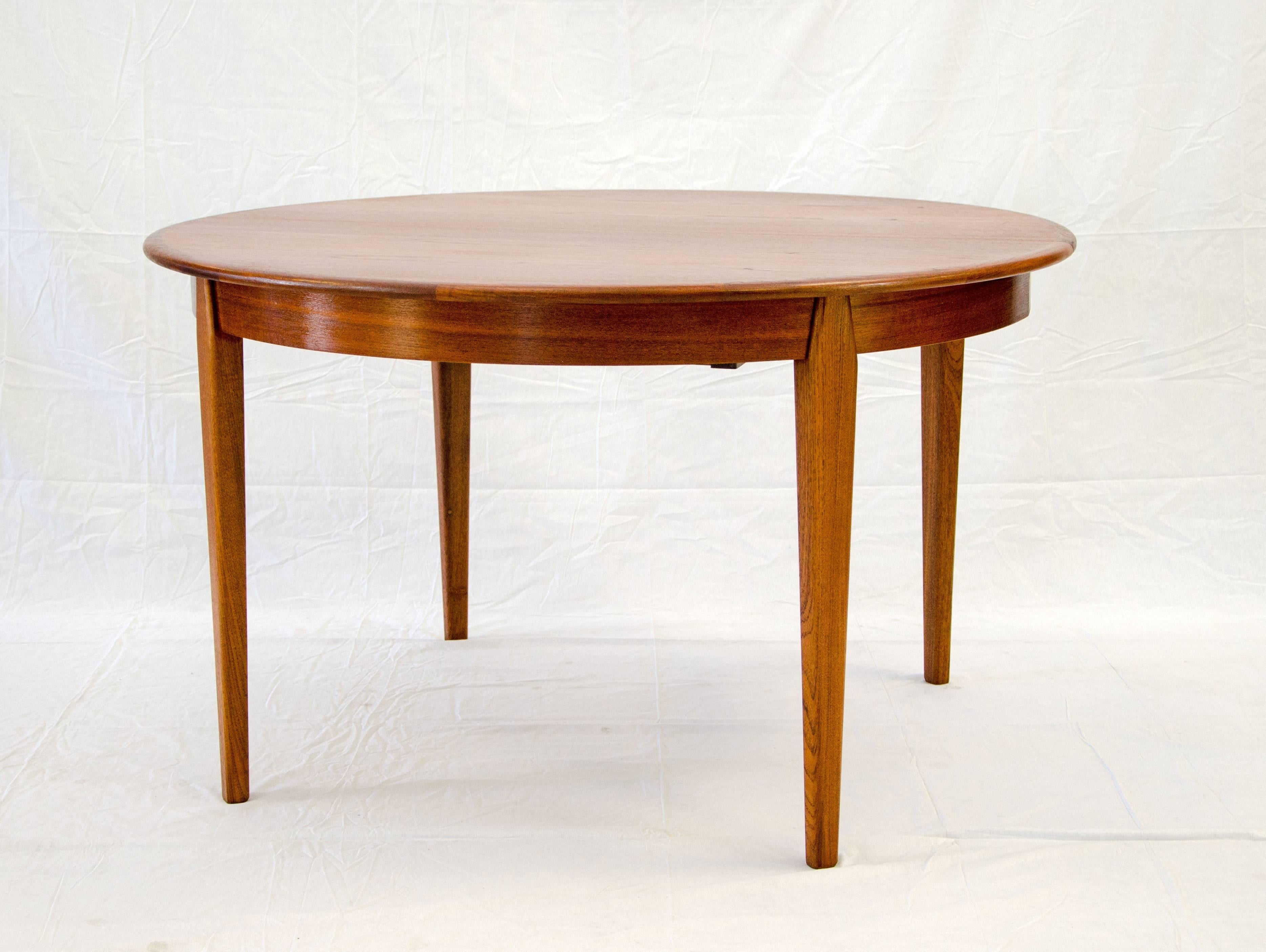 Scandinavian Modern Danish Teak Round Dining Table, Three Leaves with Aprons by H. Sigh & Sons