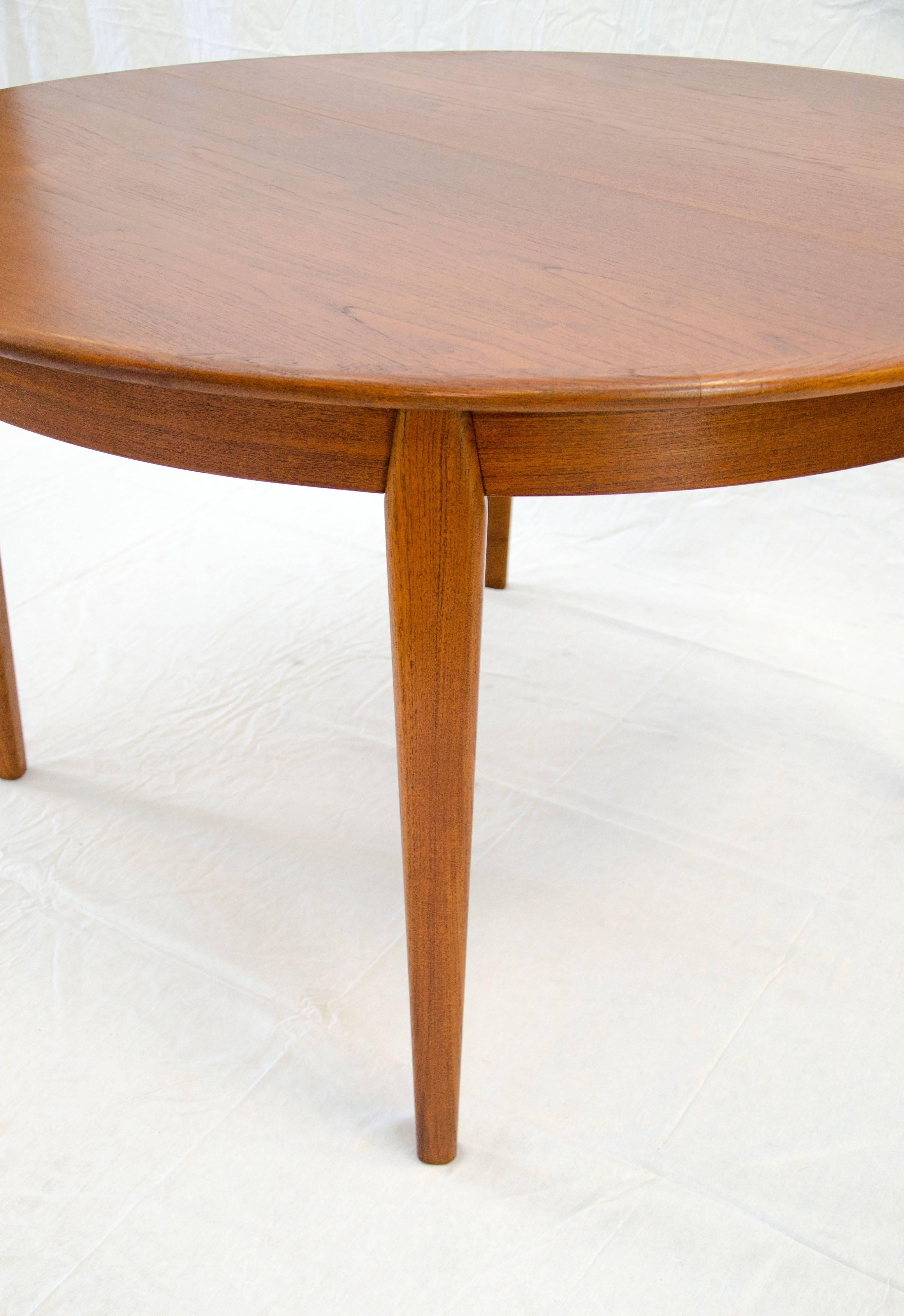 20th Century Danish Teak Round Dining Table, Three Leaves with Aprons by H. Sigh & Sons