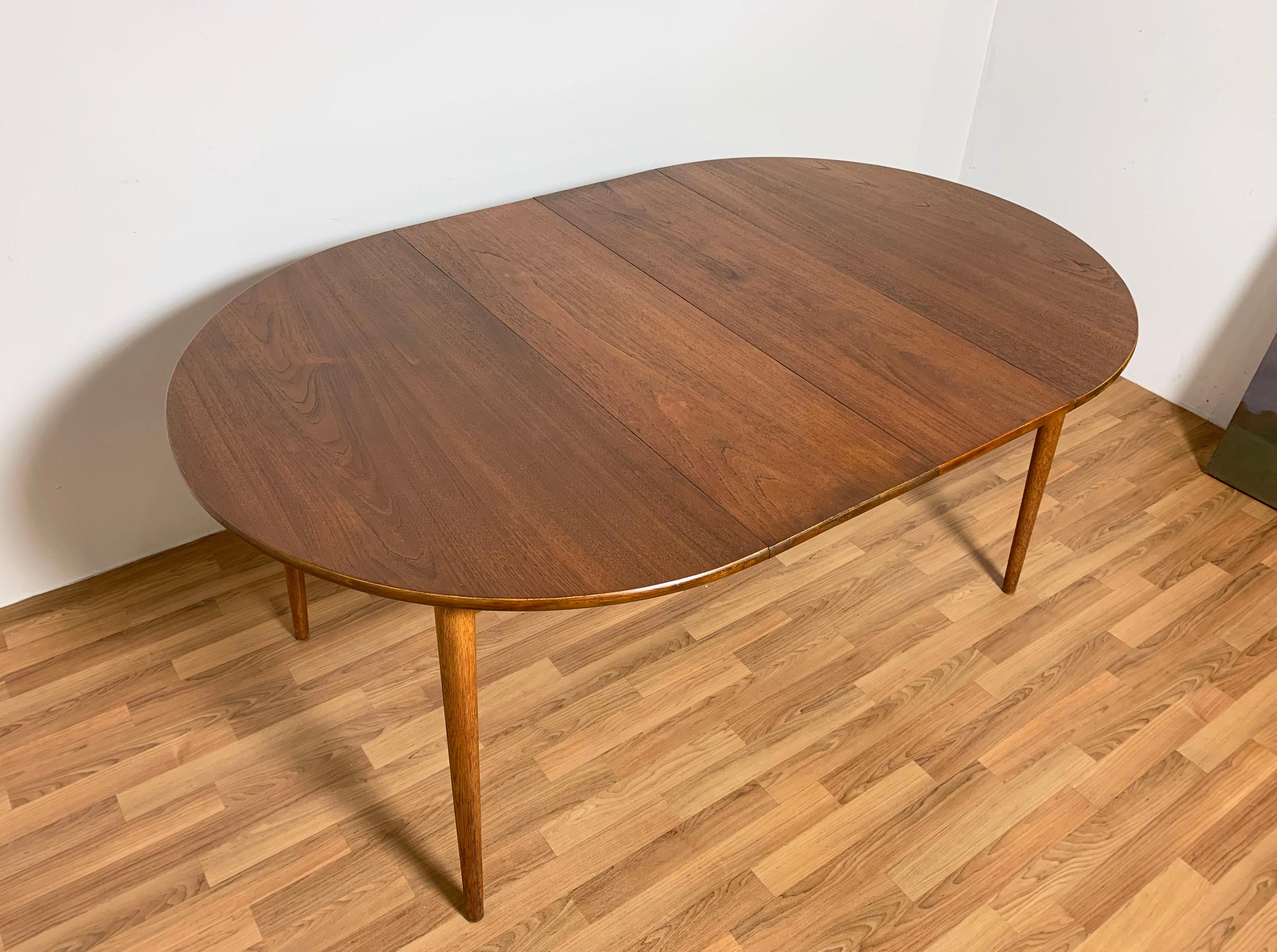Danish Teak Round Dining Table with Two Leaves, Circa 1950s In Good Condition In Peabody, MA