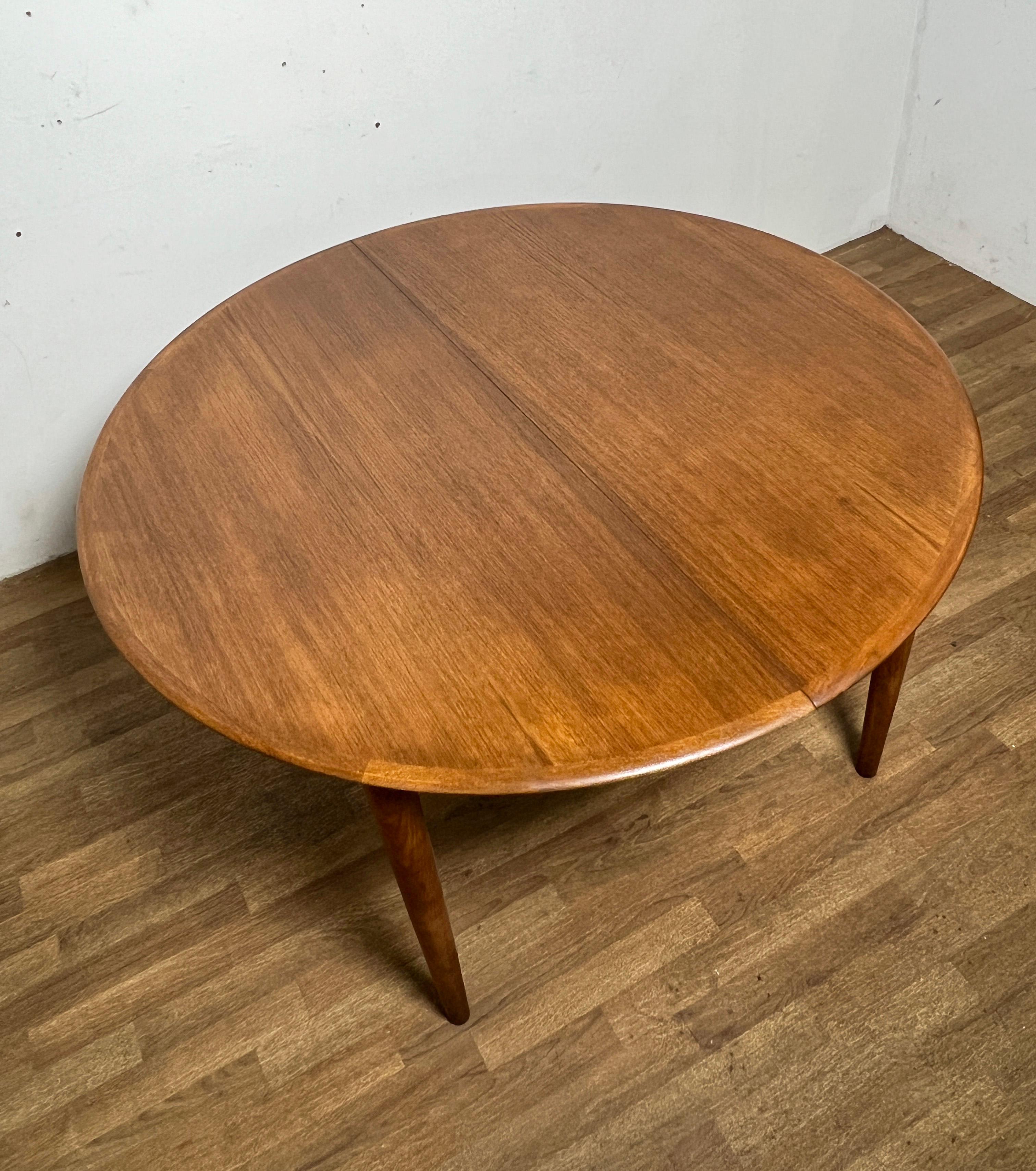 Scandinavian Modern Danish Teak Round Dining Table With Two Leaves, Circa 1960s
