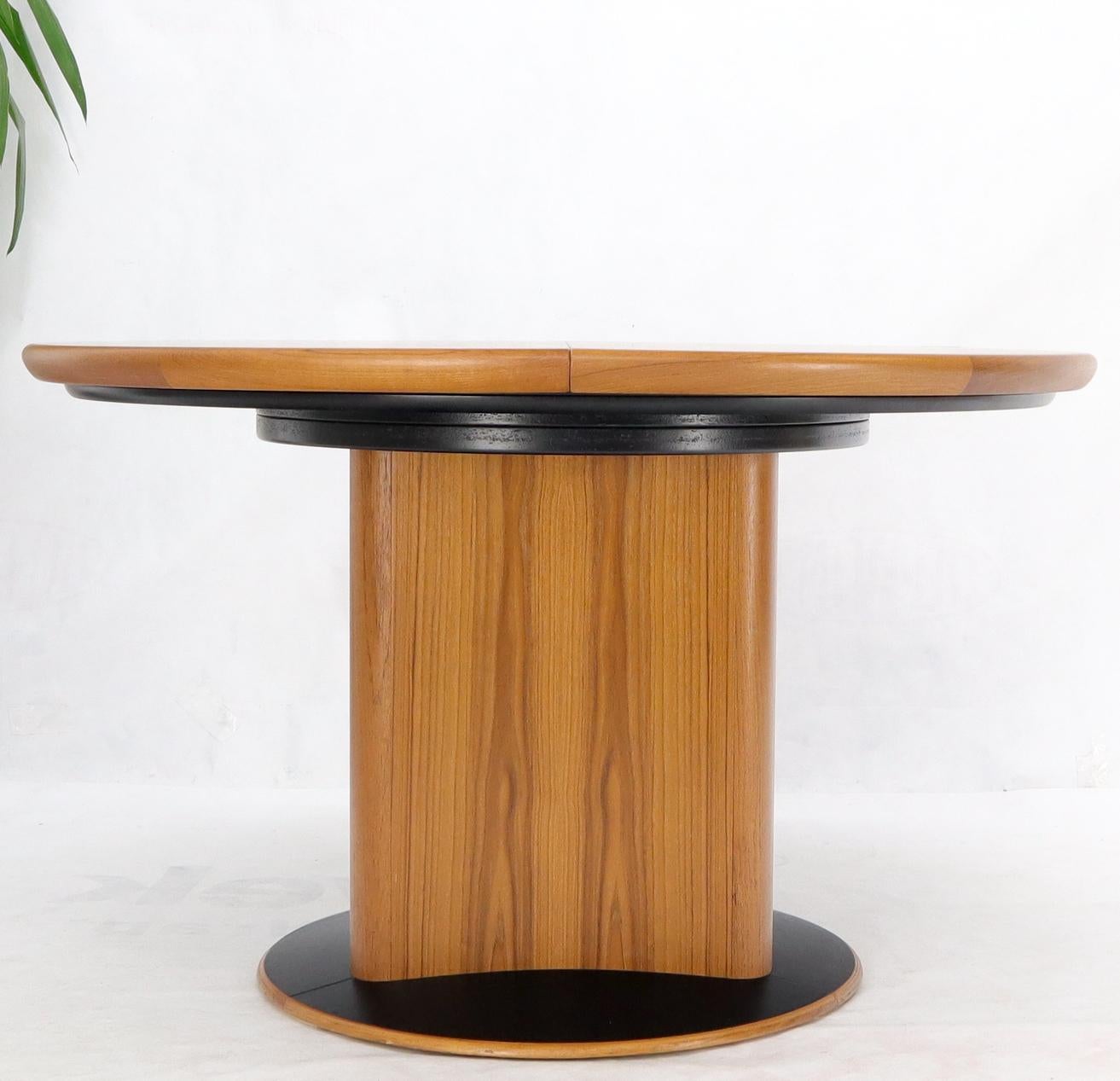 Mid-Century Modern Danish Teak Round Expandable Table with Three Self Storing Leaves