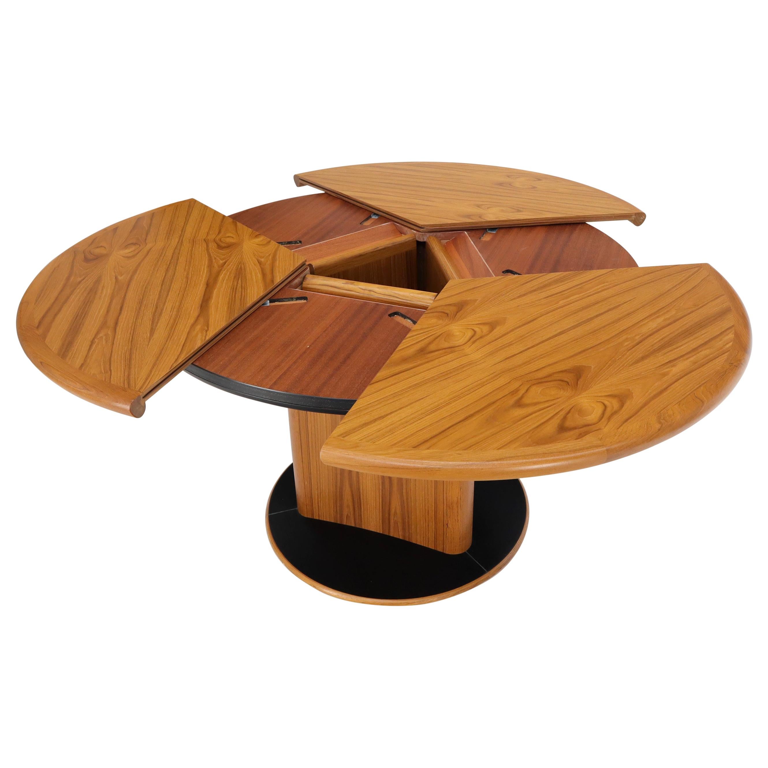 Danish Teak Round Expandable Table with Three Self Storing Leaves
