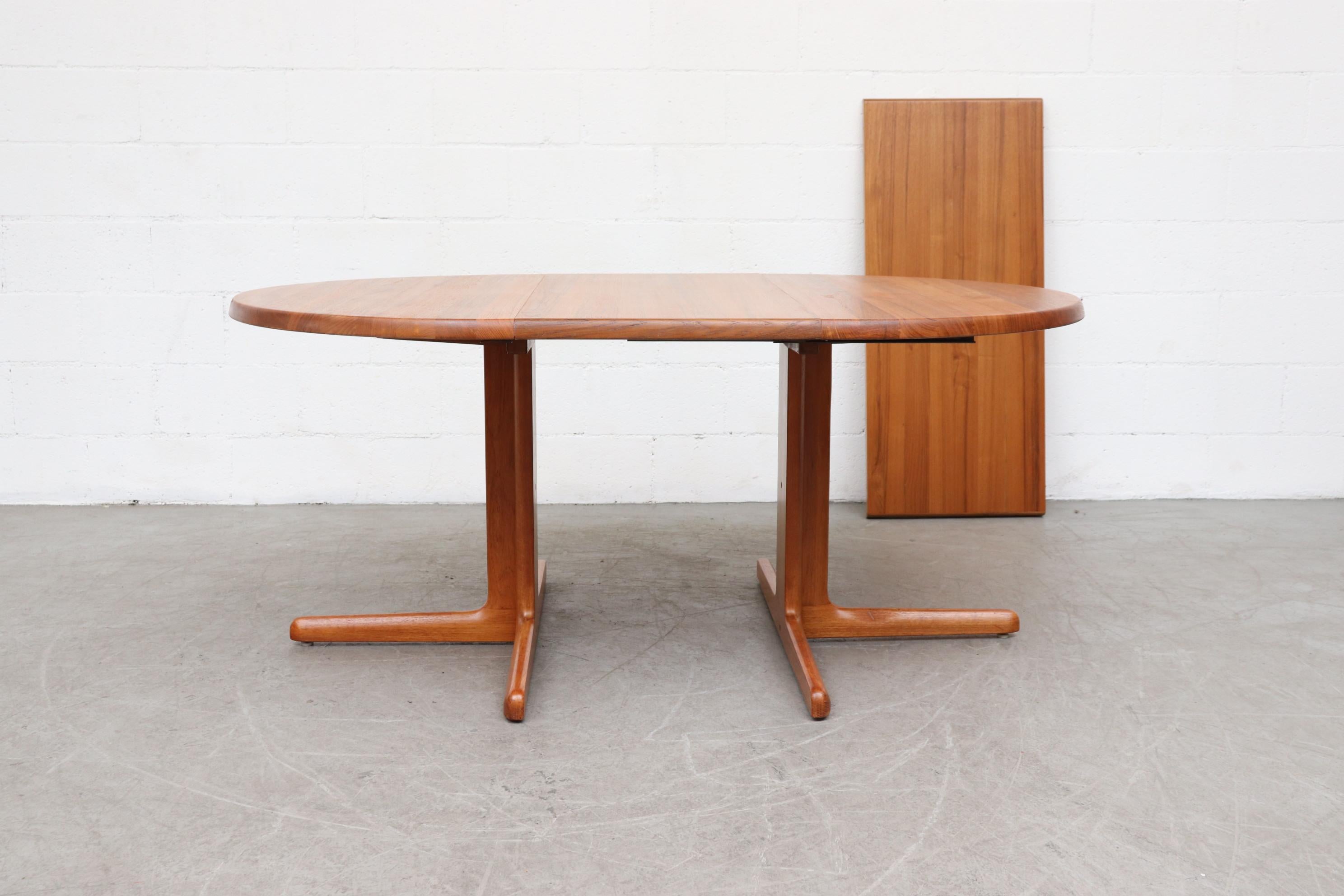 Mid-Century Modern Danish Teak Round to Oval Dining Table with 2 Leaves