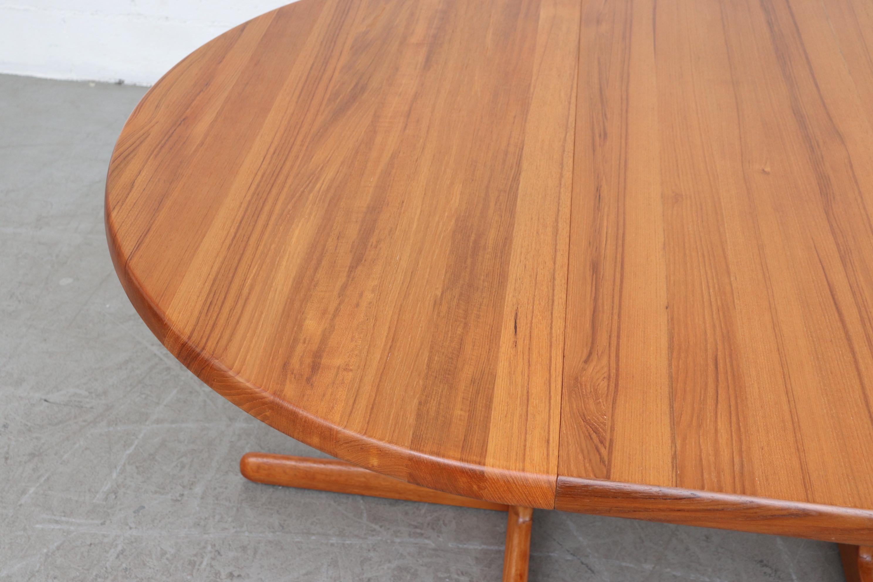 Late 20th Century Danish Teak Round to Oval Dining Table with 2 Leaves