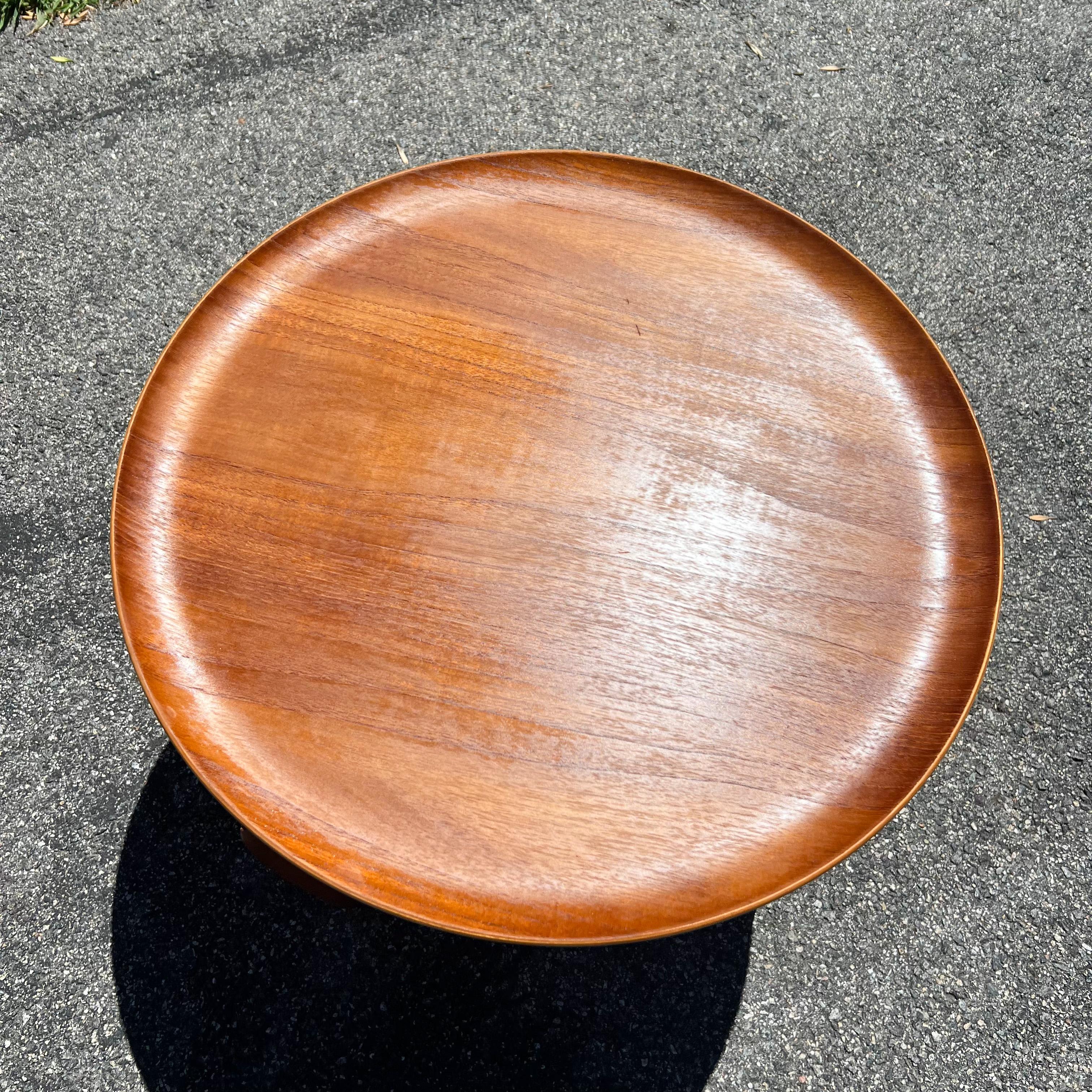 Mid-Century Modern hard to find collapsible danish teak side table designed by Illums Bolighus. Stamped on the base. Minimal wear/scuffing/scratching to the teak finish.