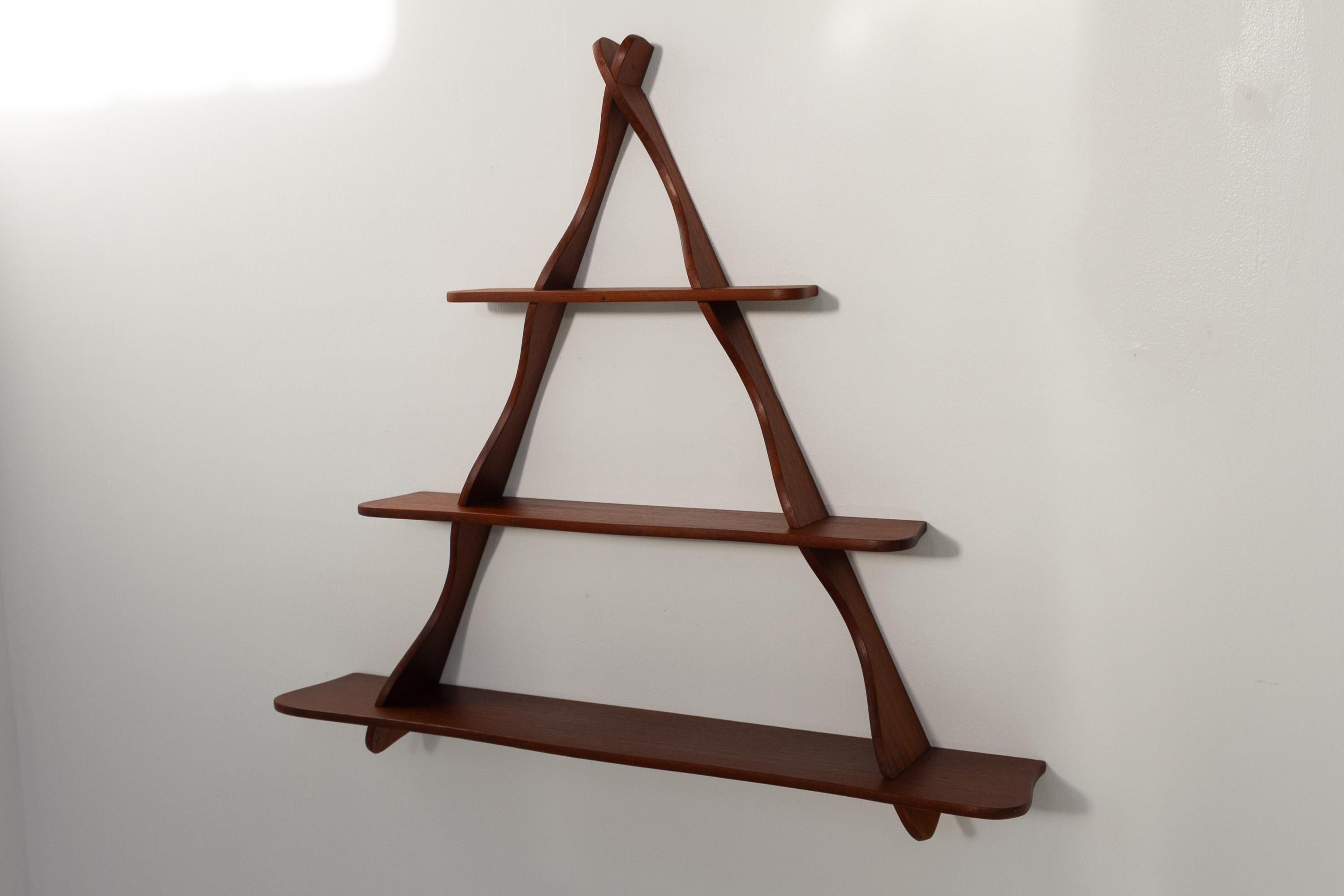Danish Teak Shelf attributed to Peder Moos, 1950s.

Scandinavian Mid-Century Modern triangular shelving unit in solid teak.
These knockdown wall shelves are attributed to Peder Moos, Denmark. They can reassebled without the use of tools.
Beautiful