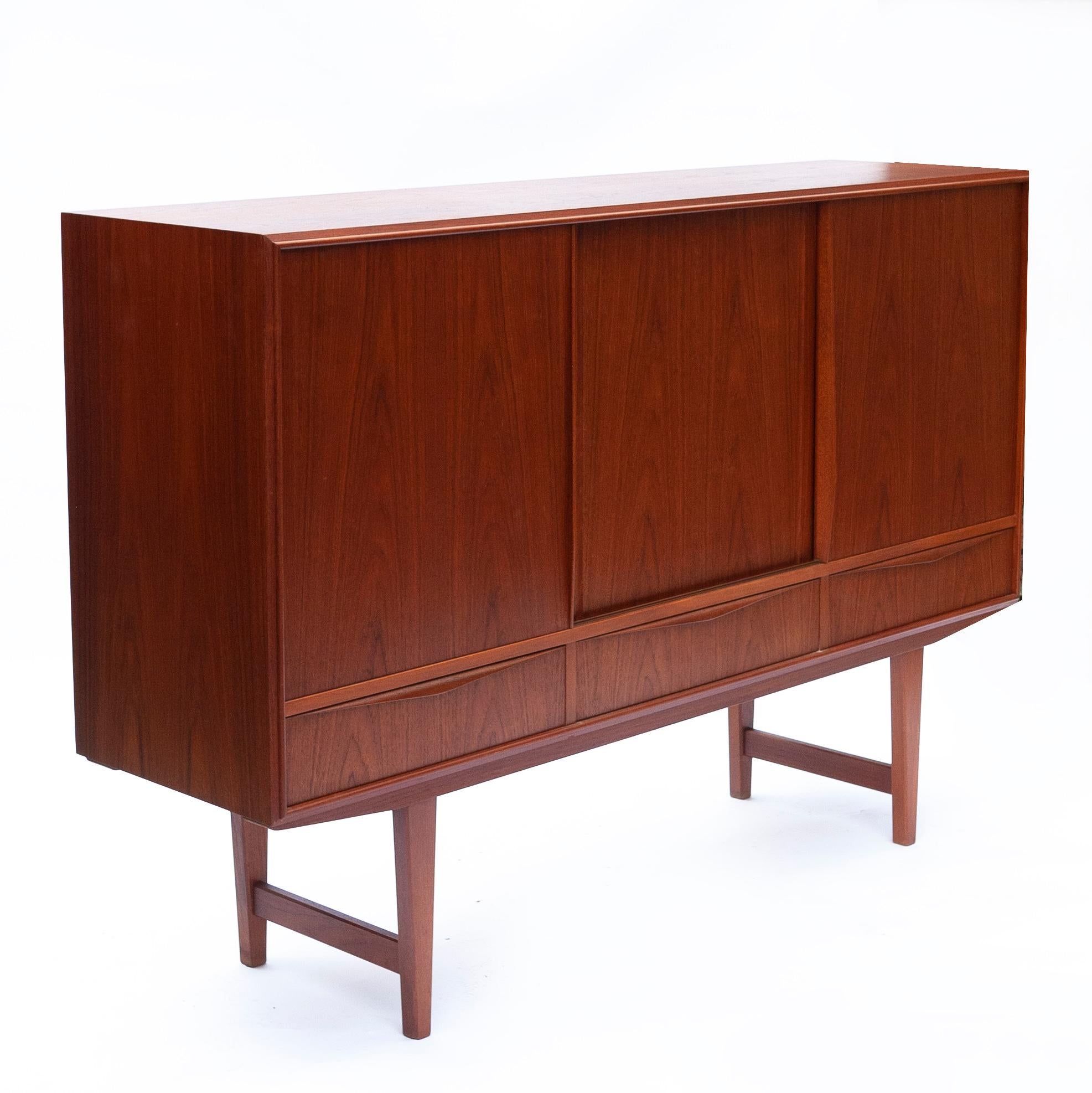 A vintage teak tambour door sideboard with inner decorative drawers, lower drawers and shelves.

Designer - E W Bach

Manufacturer - Sejling Skabe

Design Period - 1960 to 1969

Country of Manufacture - Denmark

Style -
