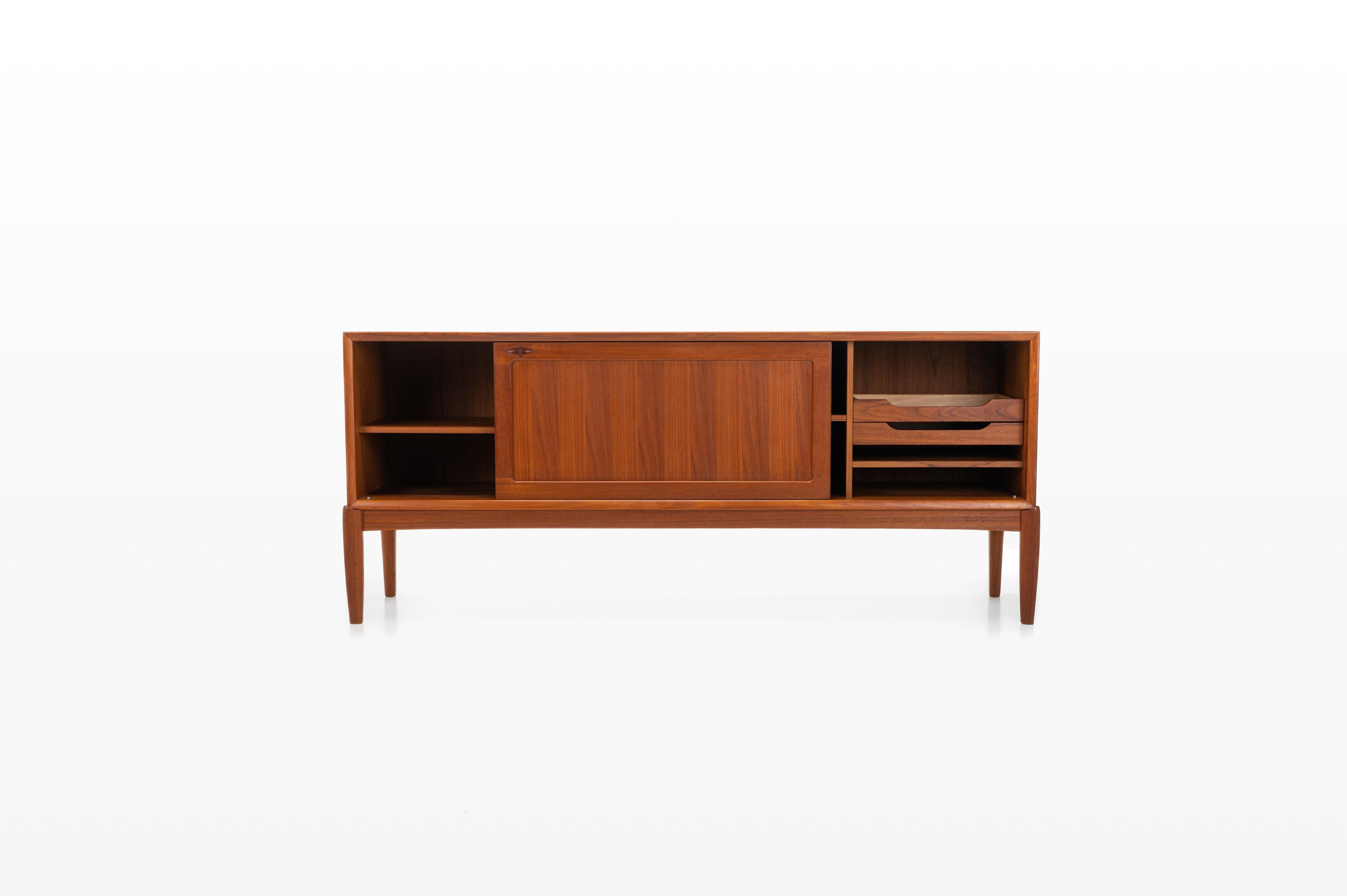 Danish sideboard designed by H.W. Klein for Bramin 1950s. This teak sideboard has 2 inner drawers, a lot of storage space and 2 sliding doors.