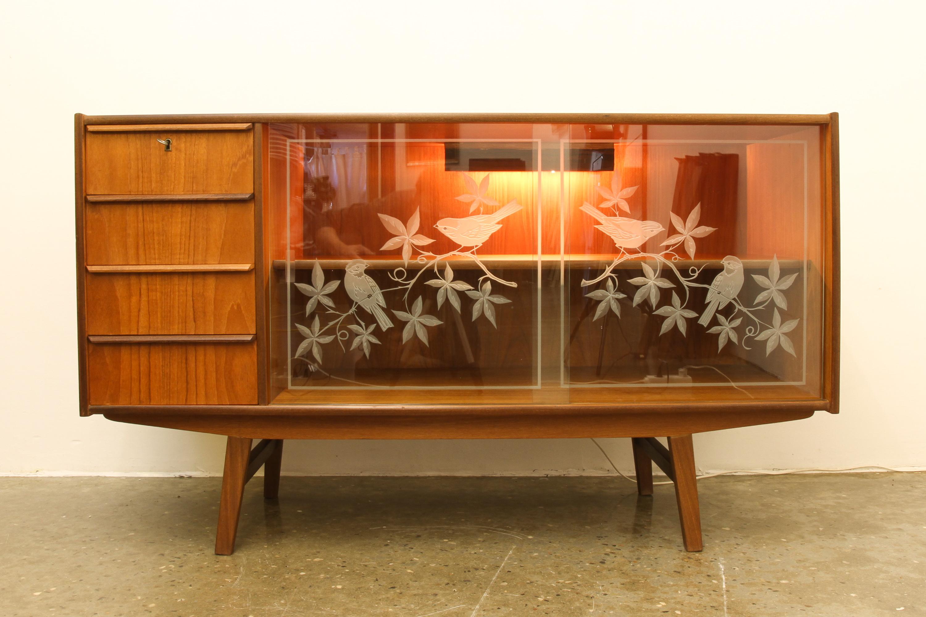 mid century sideboard with glass doors
