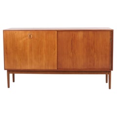 Danish Teak Sideboard with Sliding Doors, Drawers and Shelves from the 1960s