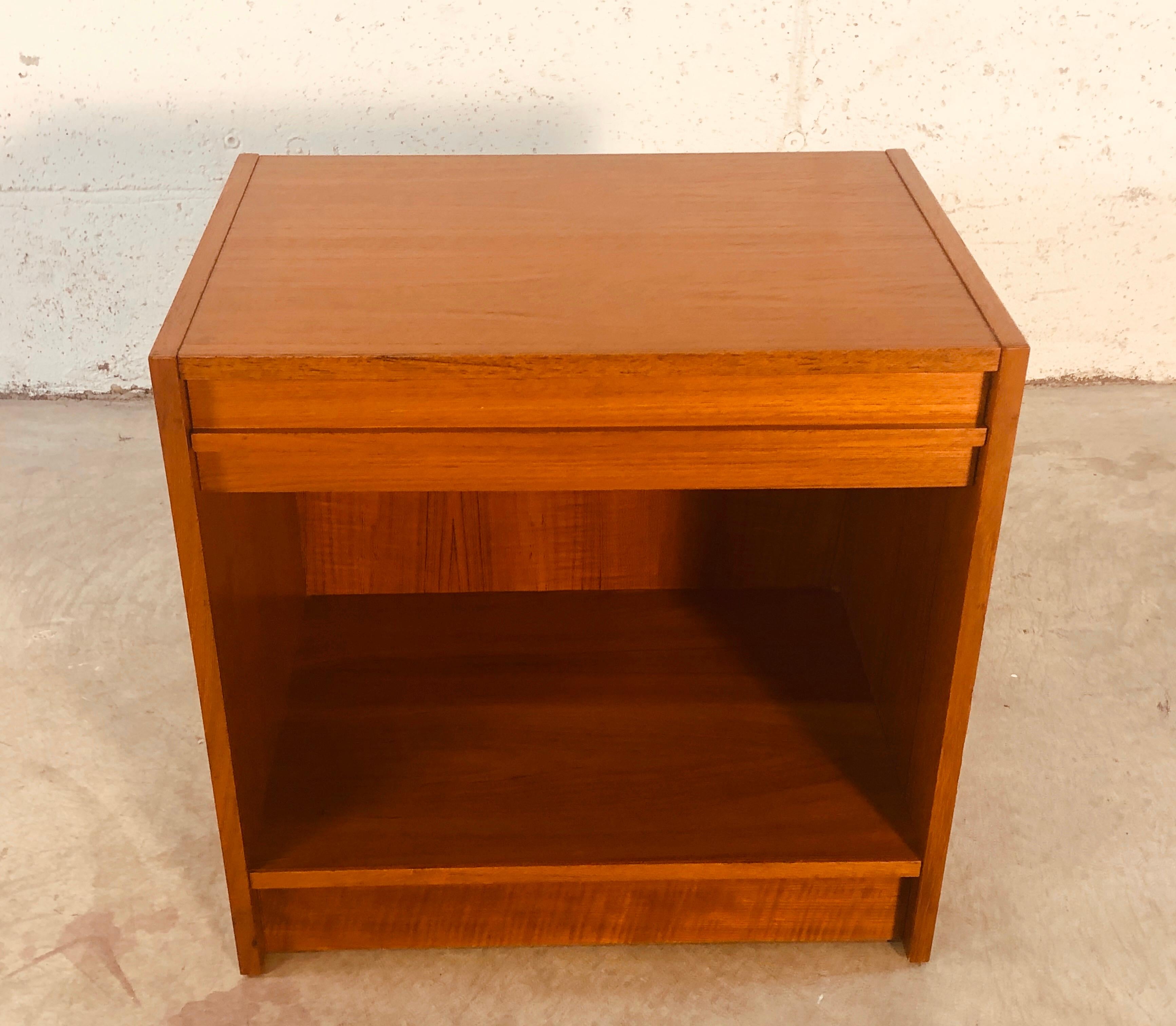 1970s Danish teak single-drawer nightstand with open storage. The nightstand is in refinished condition. Marked Denmark.