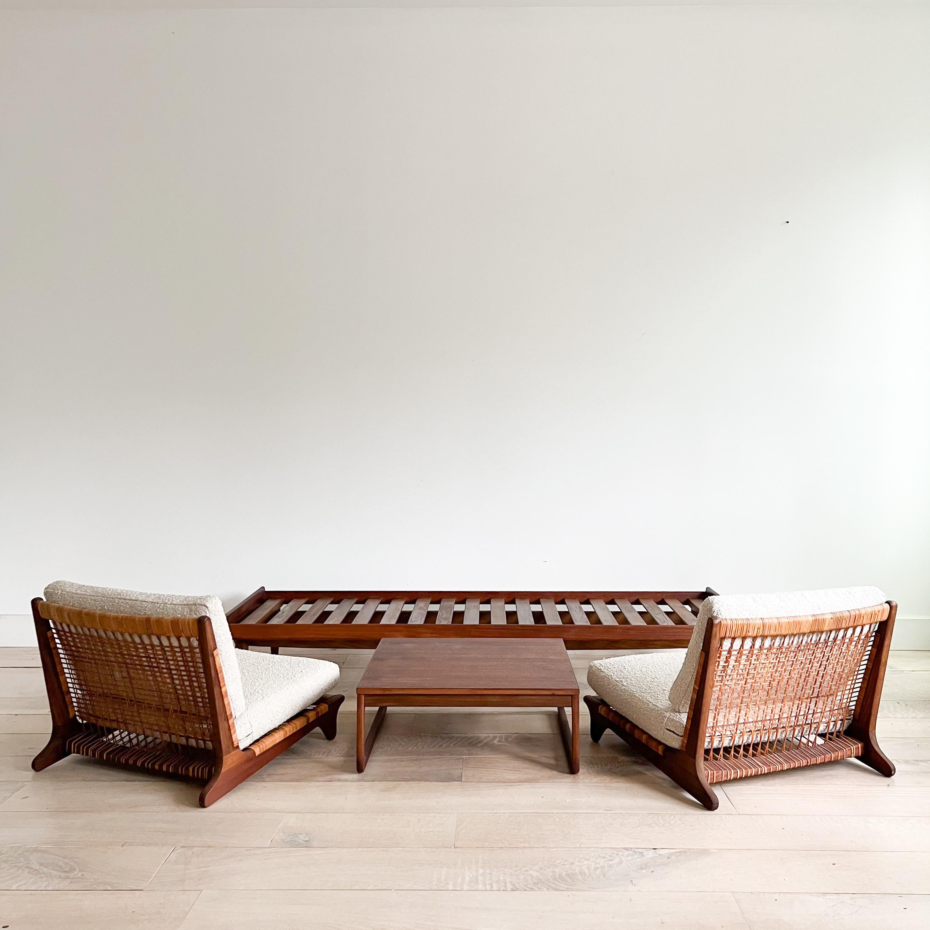 This Danish teak sofa/bench by the renowned Hans Olsen for Bramin is a true gem that seamlessly blends sophistication and comfort. The piece has been thoughtfully restored with new foam and adorned in luxurious oatmeal bouclé upholstery.

While the