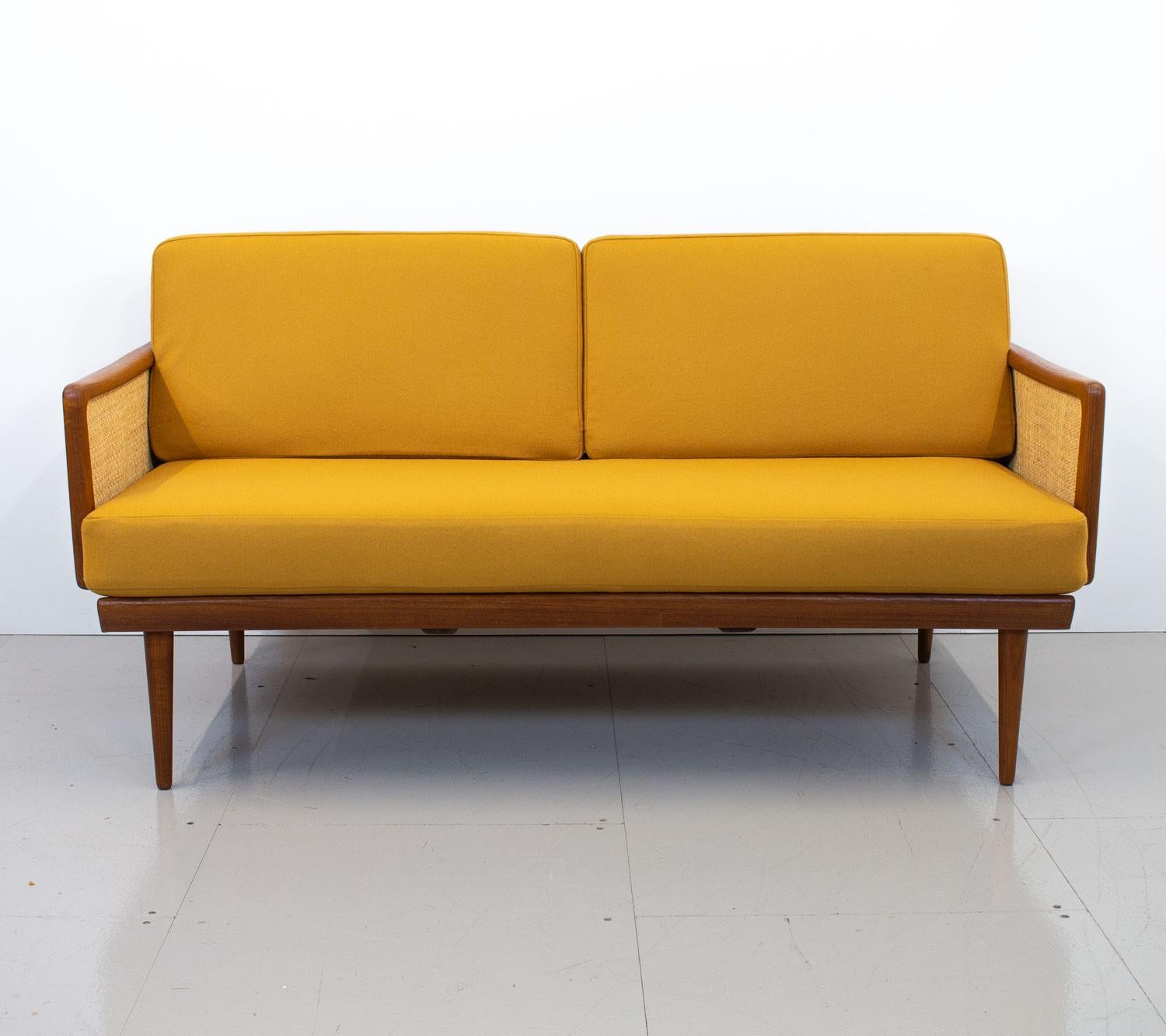 A beautiful example of a France & Sons FD453 sofa/daybed designed by Peter Hvidt and Orla Mølgaard Nielsen in the late 1950s. On this particular model both armrests drop down transforming it into a daybed and these can also be used as occasional