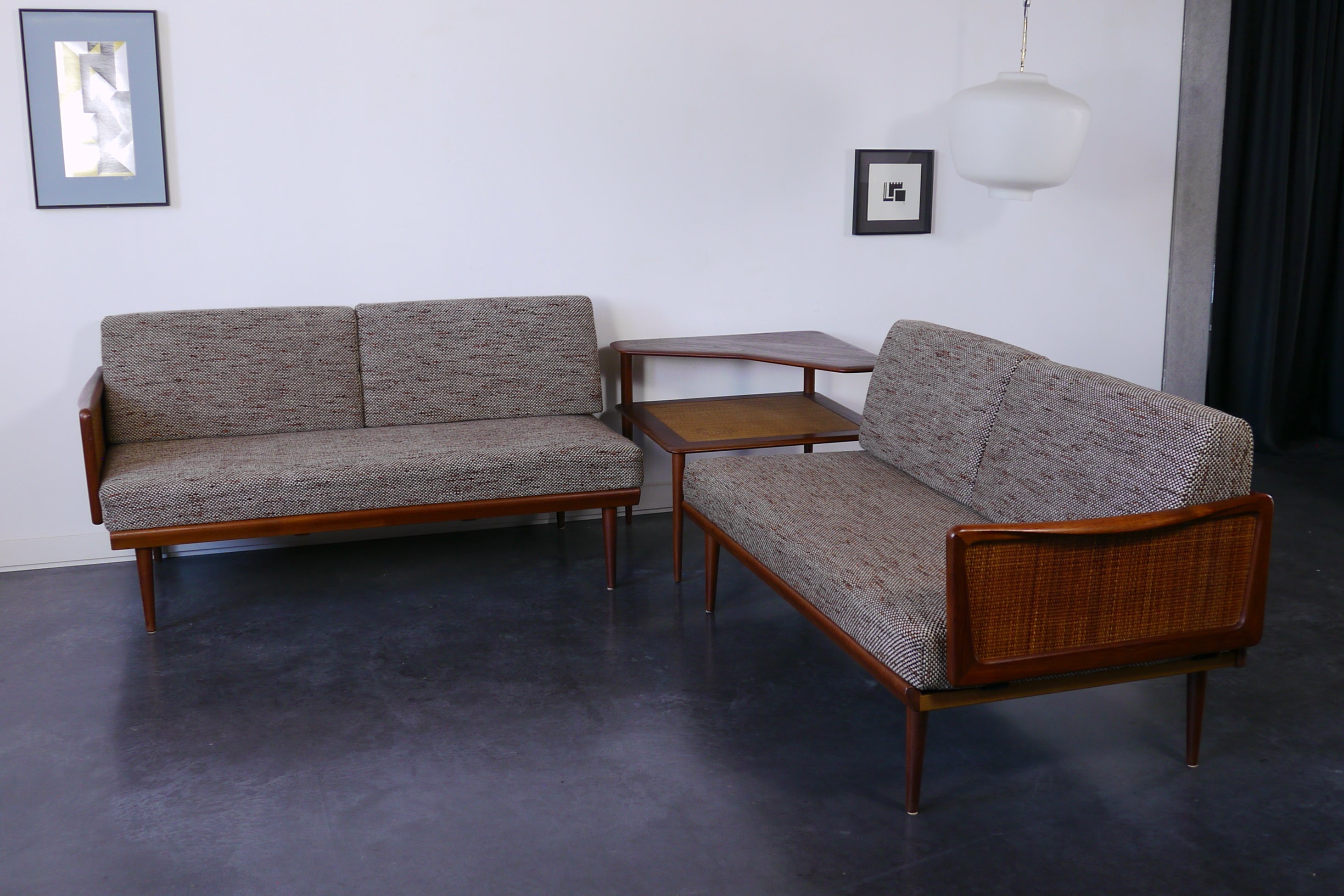 This modular living room set was designed by the Danish architects Peter Hvidt & Orla Mølgaard Nielsen. It was produced in Denmark by France & Daverkosen during the 1950's. The set includes two modular 2-seater sofa and a corner coffee table model