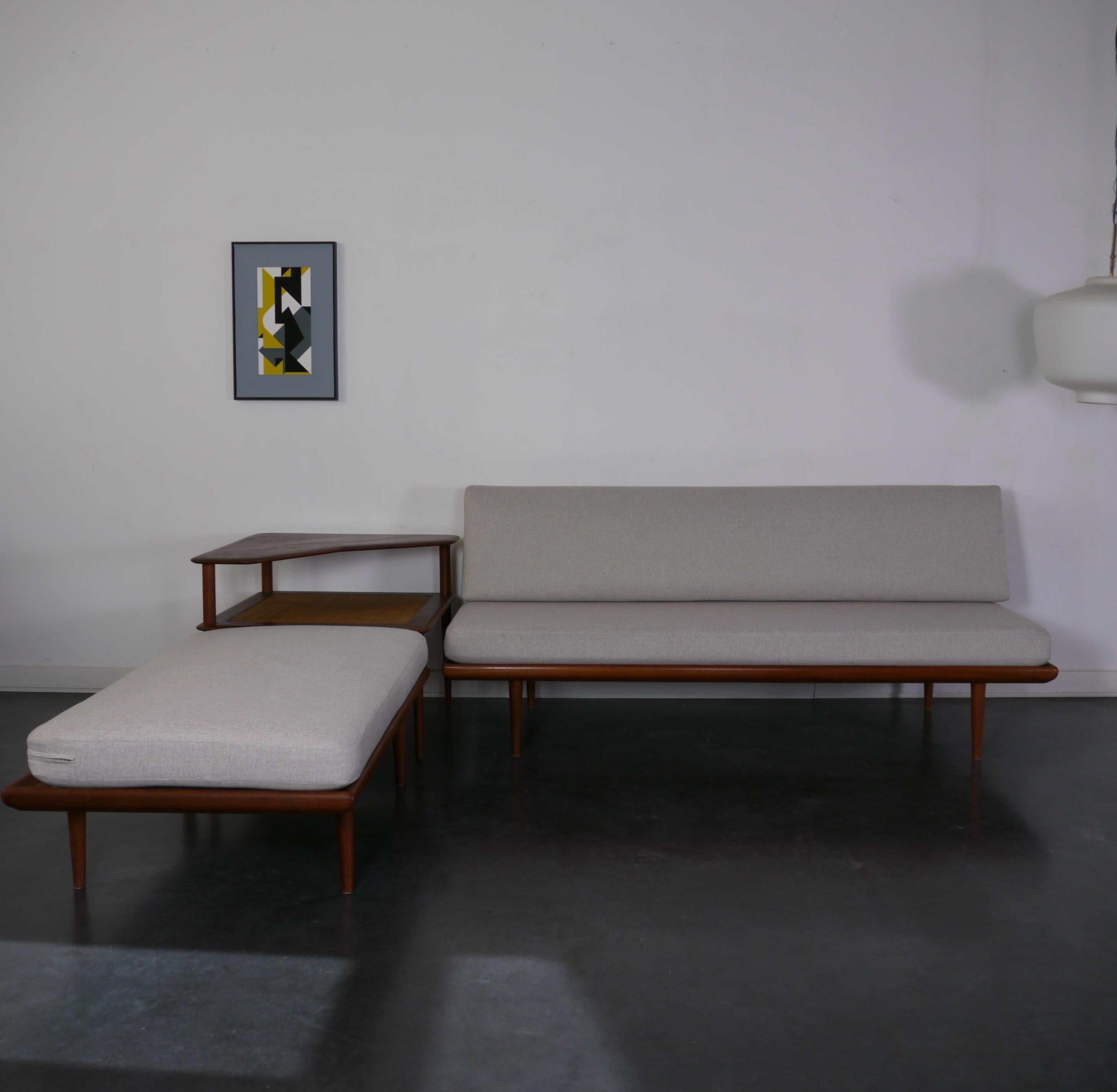This modular living room set was designed by the Danish architects Peter Hvidt & Orla Mølgaard Nielsen. It was produced in Denmark by France & Daverkosen during the 1950's. The set includes one 2-seater sofa model FD 418a, a 3-seater sofa model FD