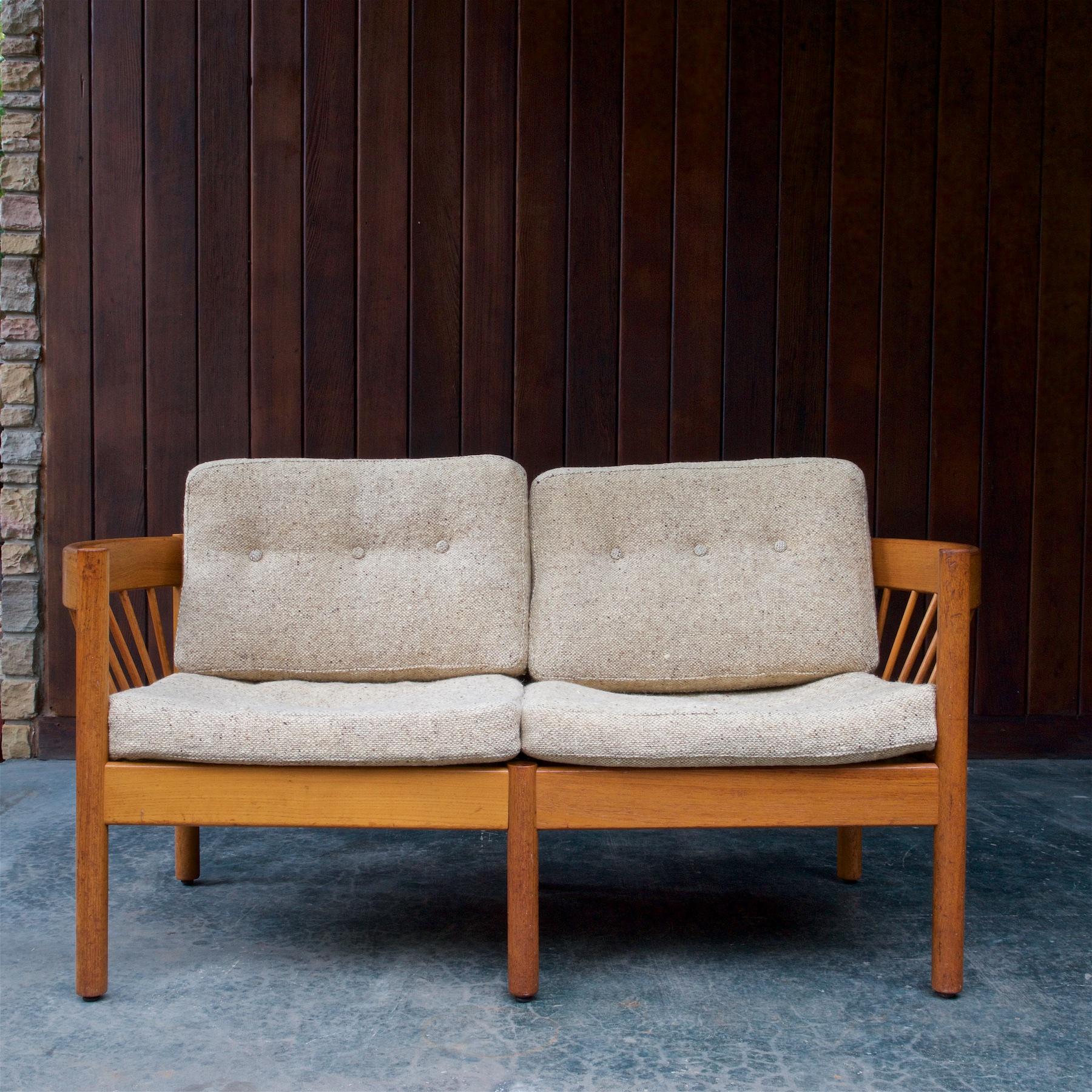 The sofa frame is strong, and without looseness, with a wonderful time worn patina. Original fabric cleaned with new foam inserted. Very comfortable, and the cushion webbing on the frame is holding fine.

The architect Jørgen Bækmark (1929) was