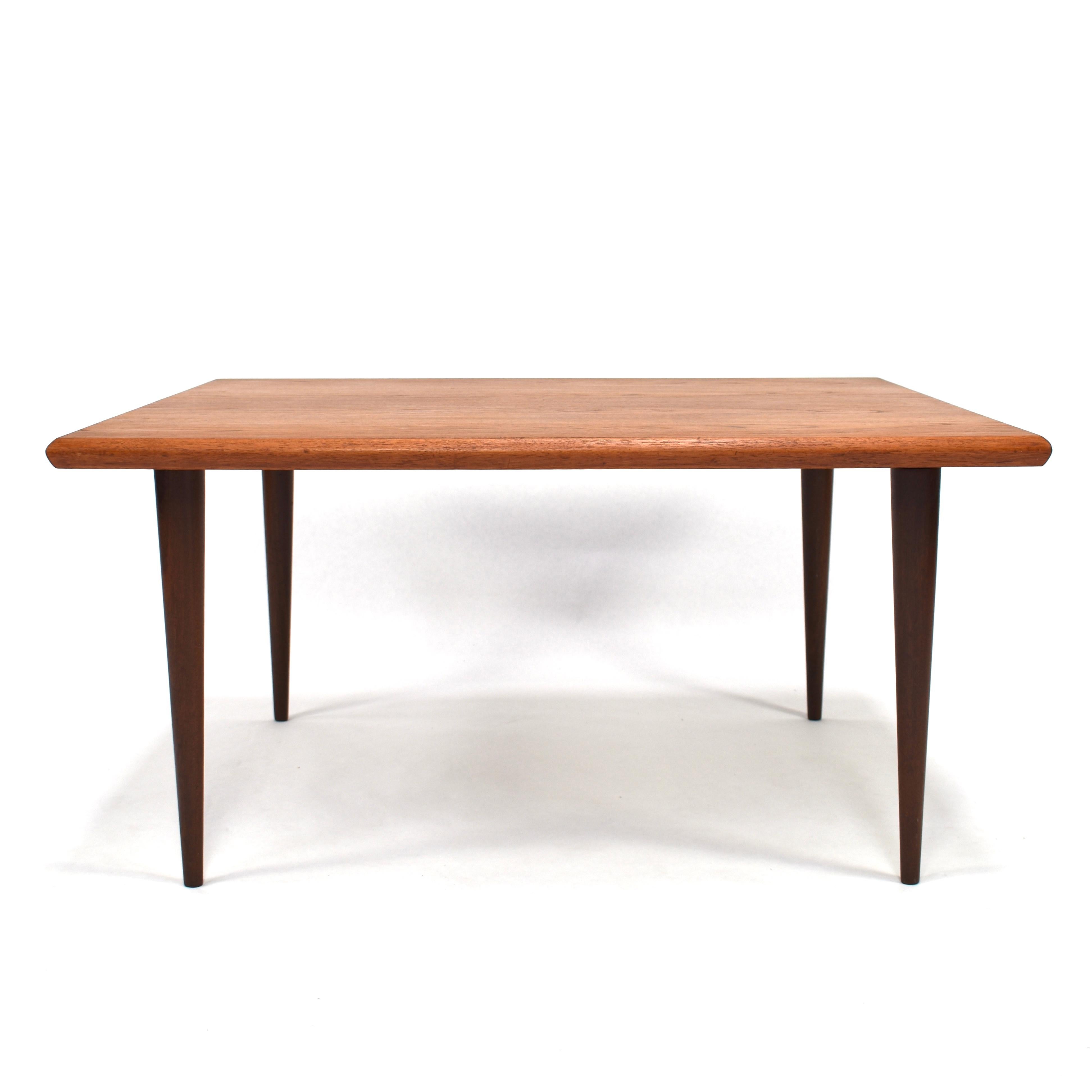 Danish square coffee table in Teak with beautiful solid teak tapered legs and solid teak edges. The legs can be screwed of.

Designer: Unknown

Manufacturer: Unknown

Country: Denmark

Model: coffee table

Material: Teak. Veneer top with