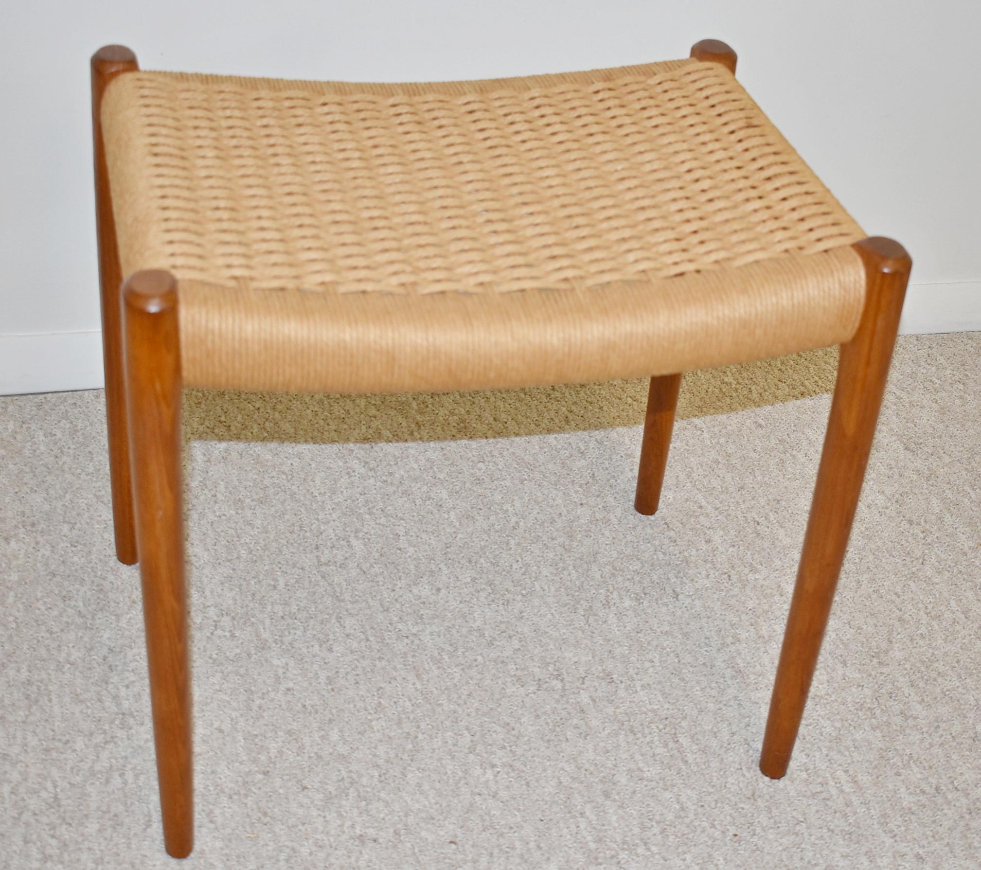 Vintage stool designed in 1963 by the Danish cabinet maker and furniture designer Niels Otto Møller (1920-1982) and manufactured by J. L. Møllers Møbelfabrik, Denmark in the 1960s. The stool is made of solid teak with the original Danish papercord