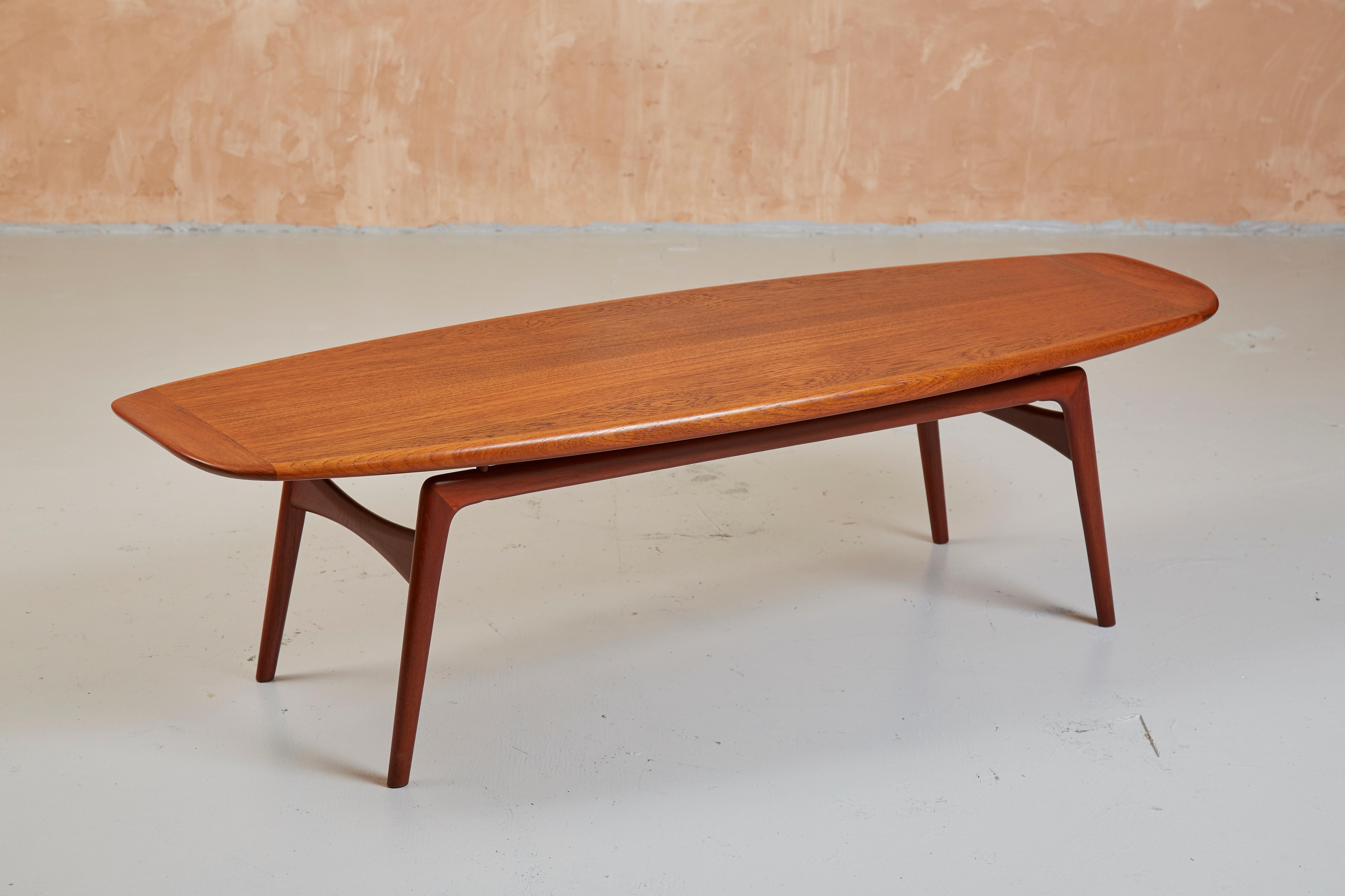 Teak 'Surfboard' table by Mogens Kold

An iconic design by Arne Hovmand Olsen for Mogens Kold produced in Denmark in the 1960s.

The long, sweeping teak table-top with upturned ends leads to this classic often being referred to as the